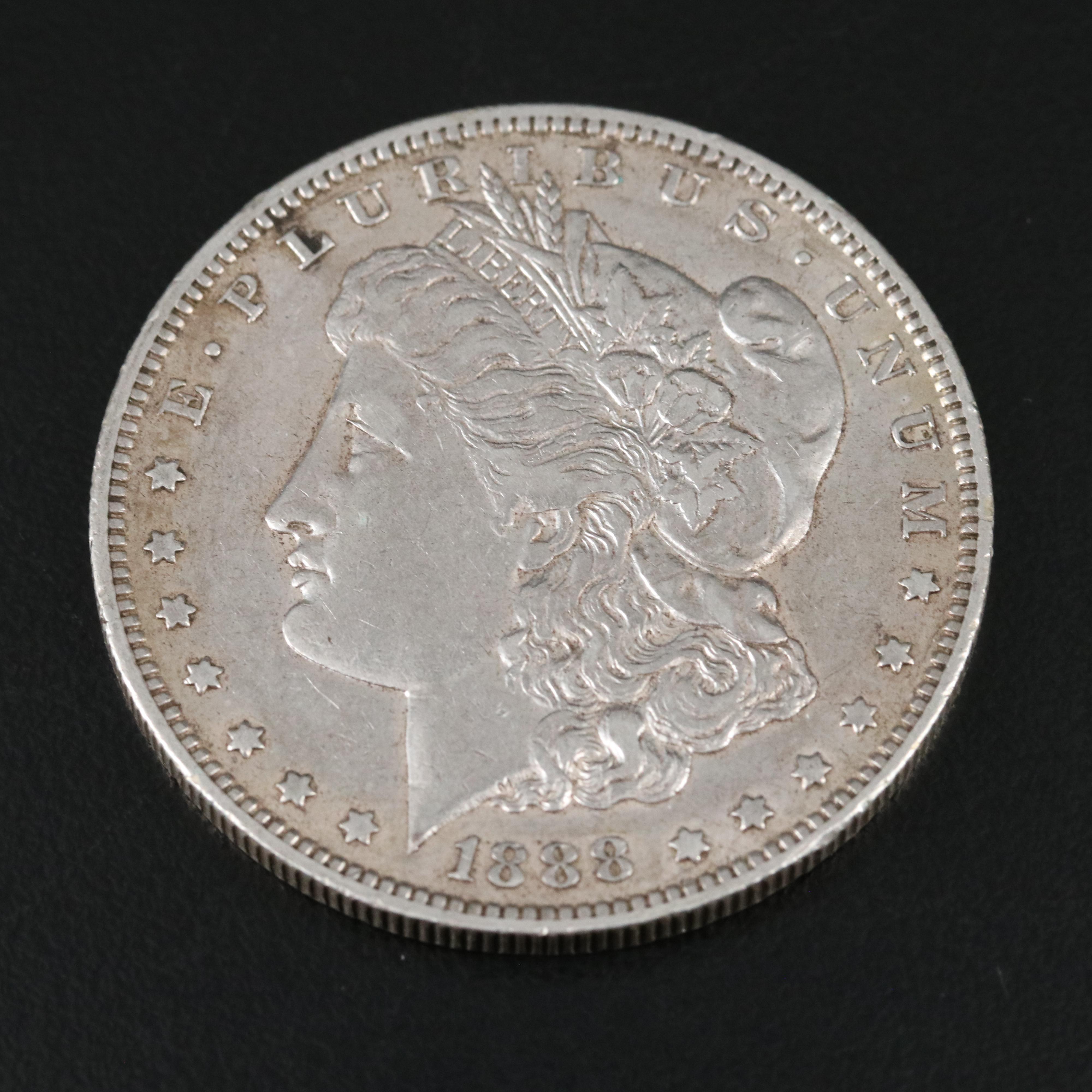 Two Morgan Dollars 1888-O, 1899-S, and a 1927 Peace Dollar