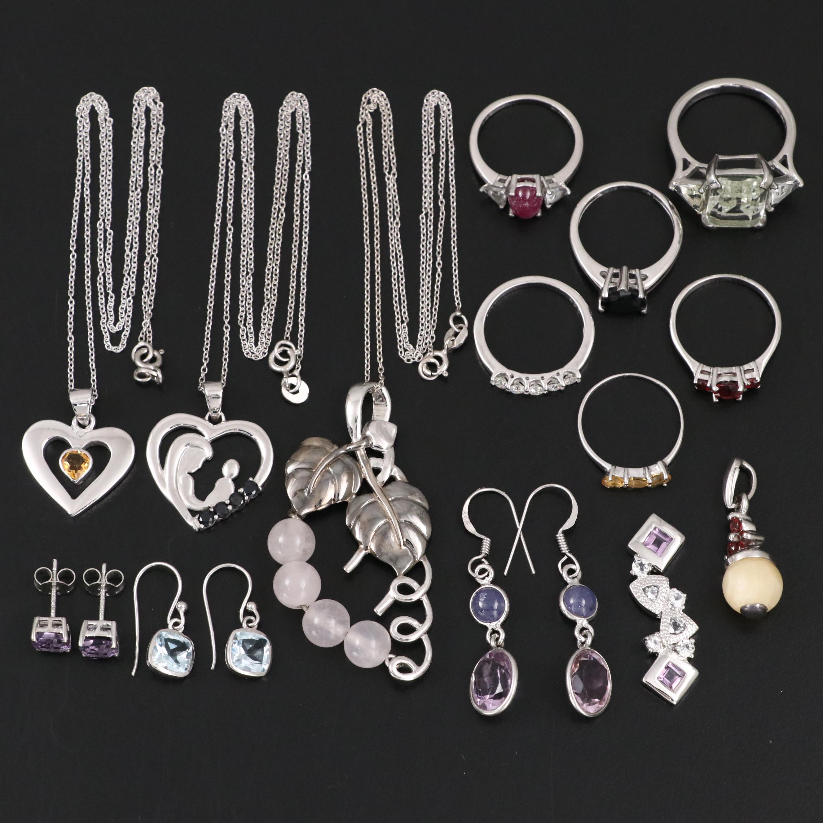 14 Assorted Sterling Silver Rings, Necklaces, Earrings, and Pendants.
