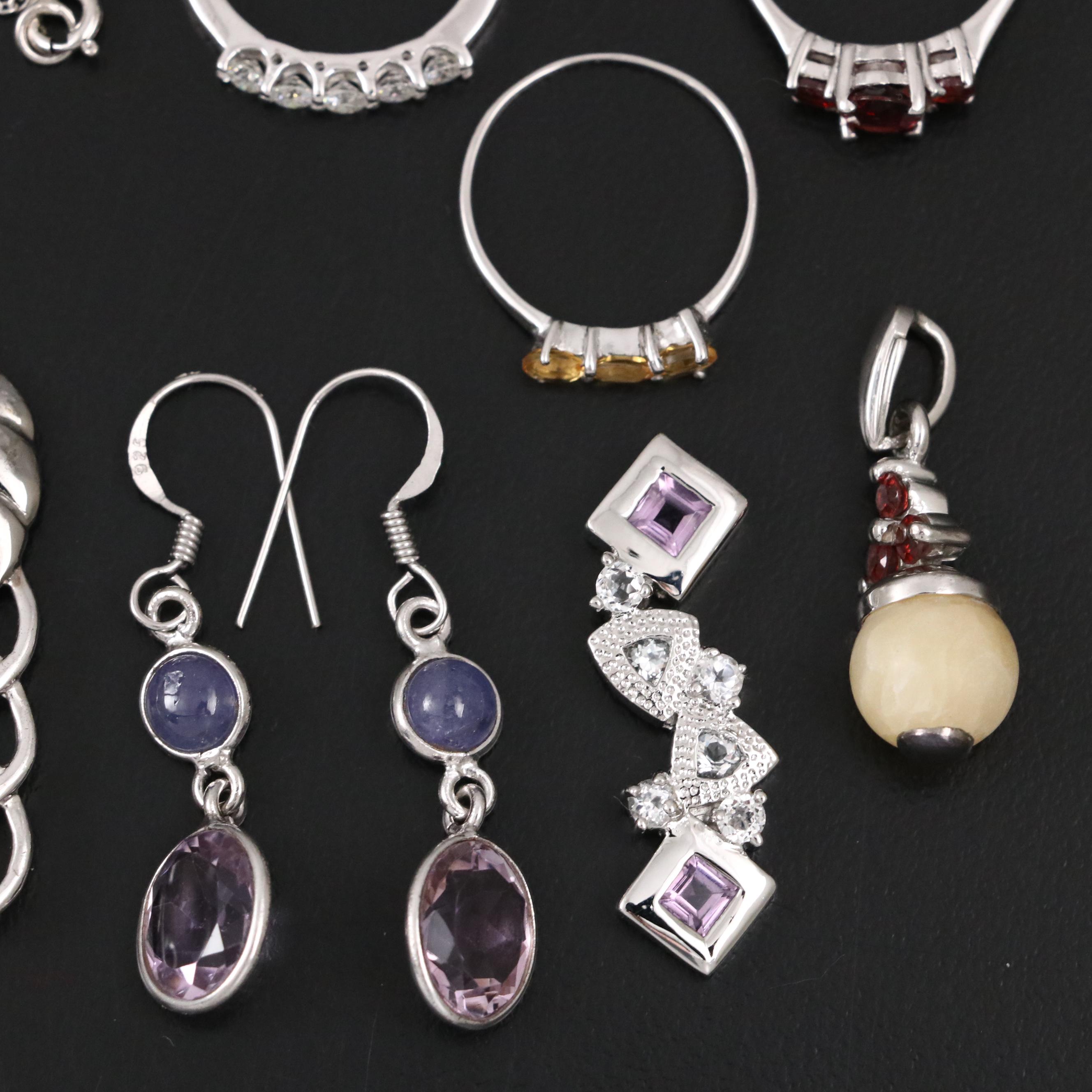 14 Assorted Sterling Silver Rings, Necklaces, Earrings, and Pendants.