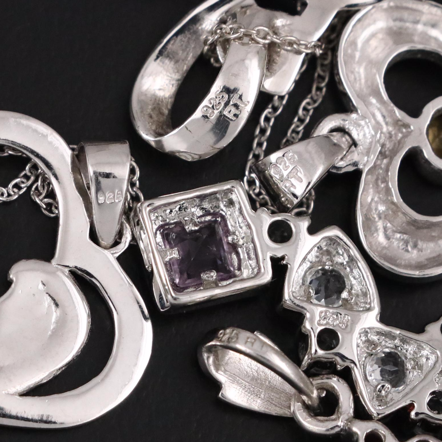 14 Assorted Sterling Silver Rings, Necklaces, Earrings, and Pendants.