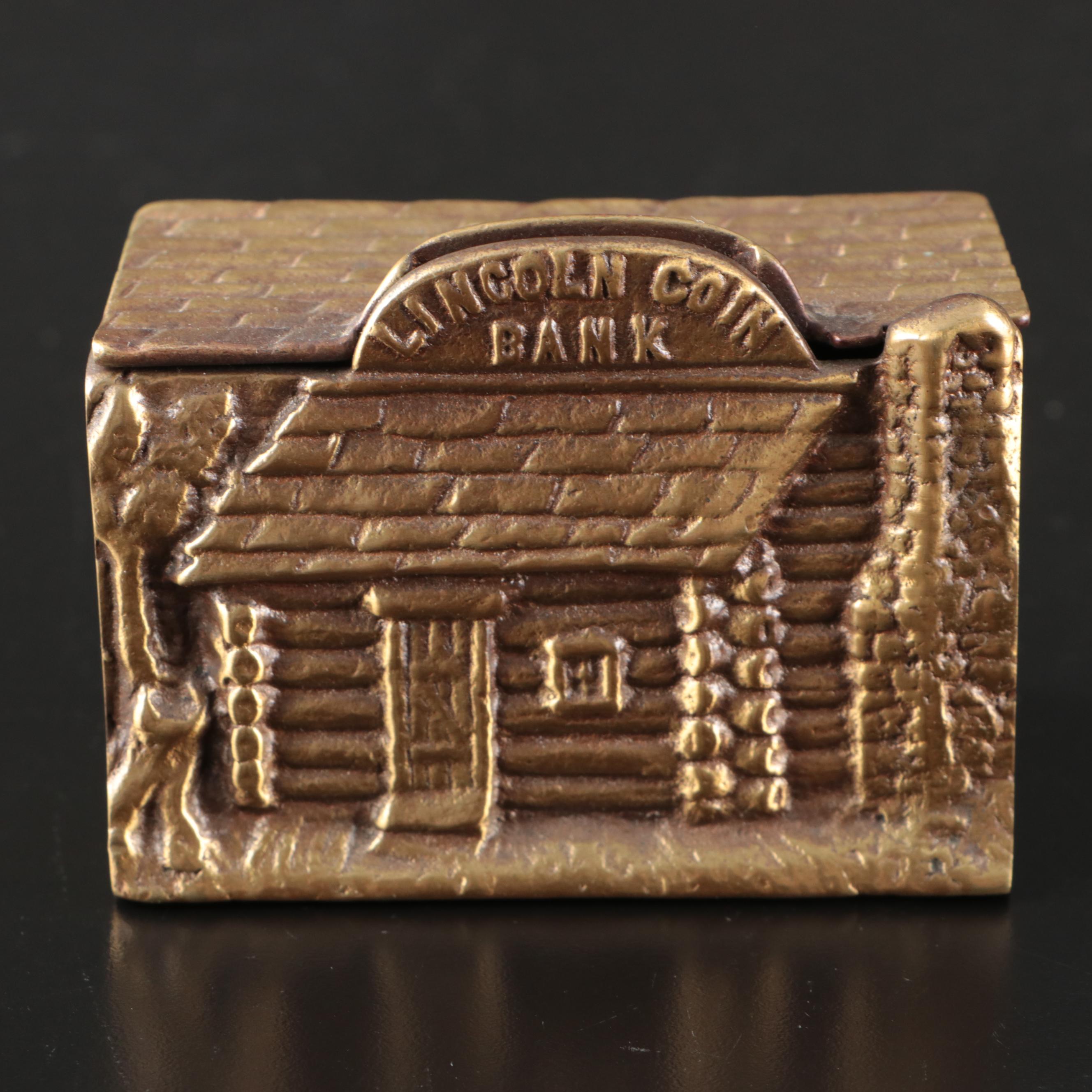 Cast Iron Lincoln Cabin Coin Banks, Early to Mid-20th Century