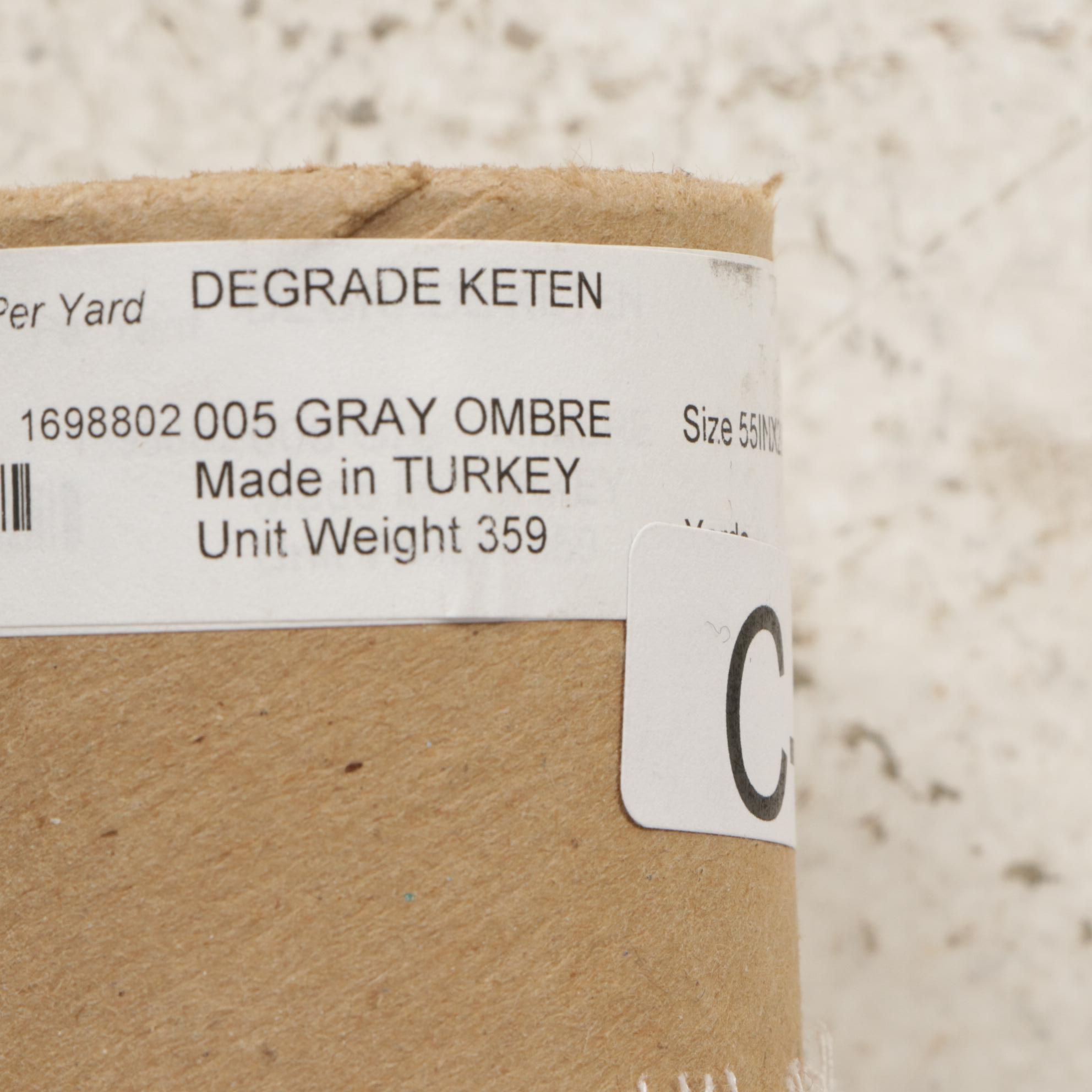 Sheer Gray Ombre and Felt Style Dark Gray Fabric Bolts