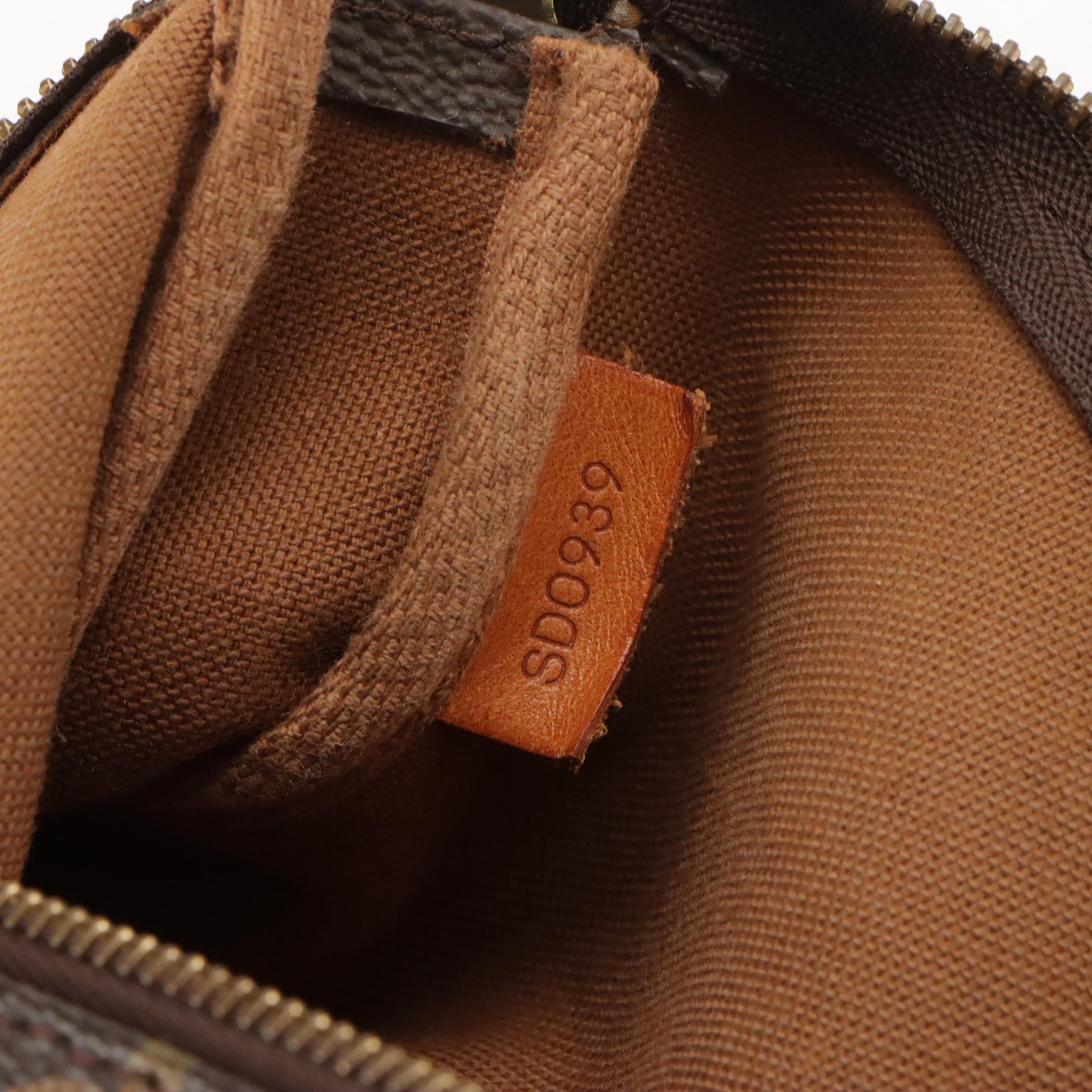 Louis Vuitton Zip Pochette Bag in Monogram Canvas and Leather