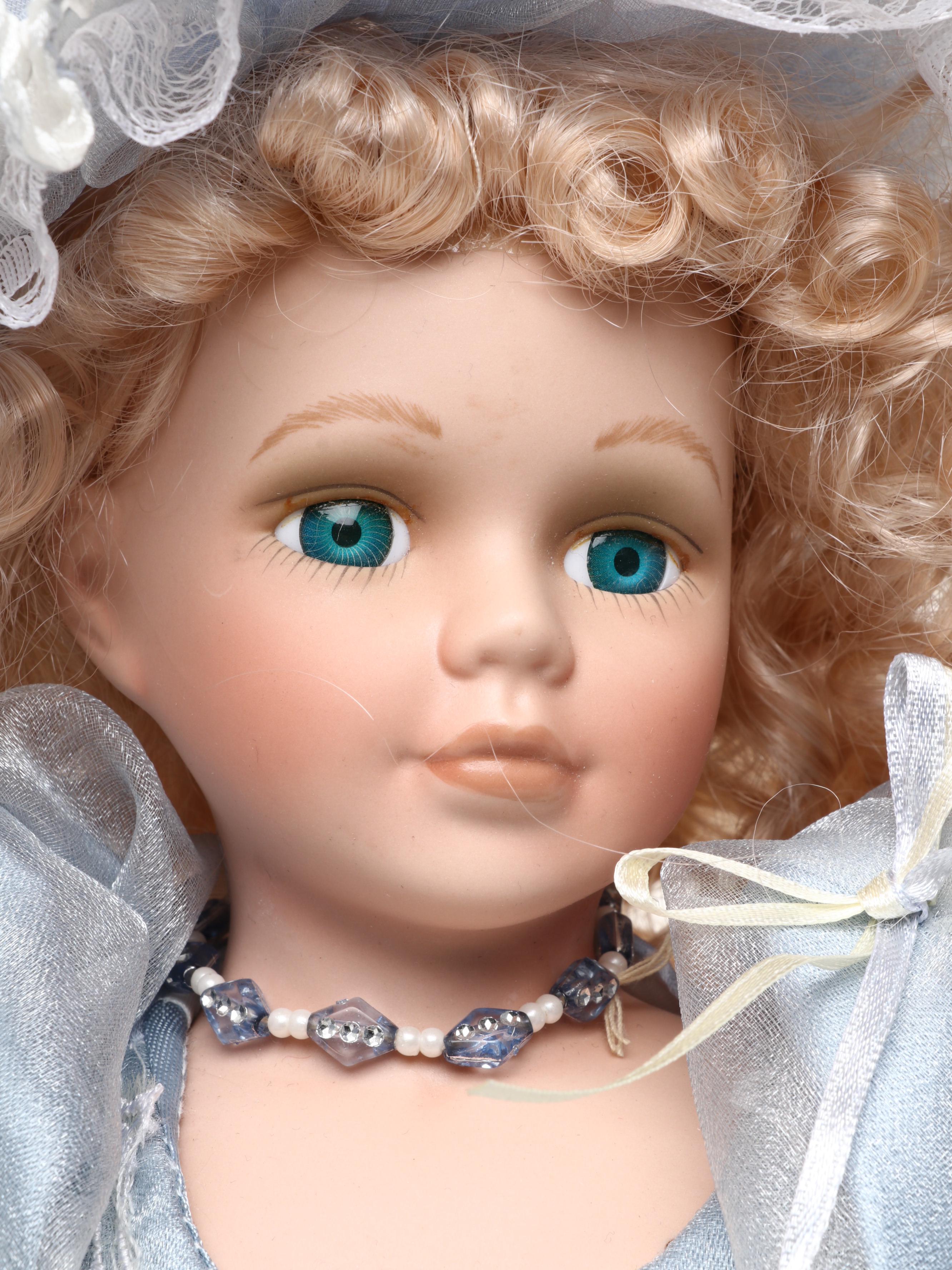 Pair of Emerald Doll Collection Porcelain Dolls, 2004