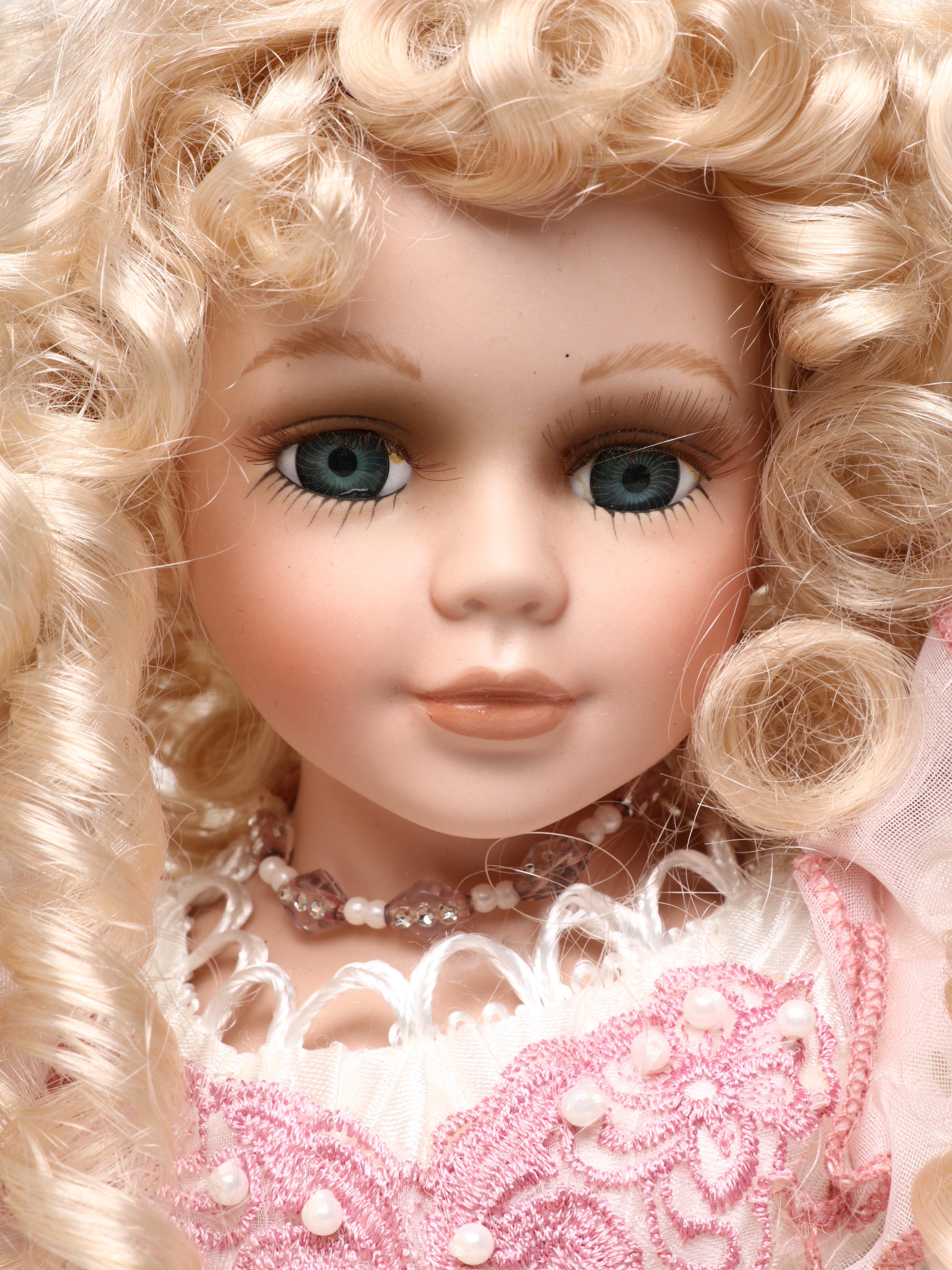 Pair of Emerald Doll Collection Porcelain Dolls, 2004