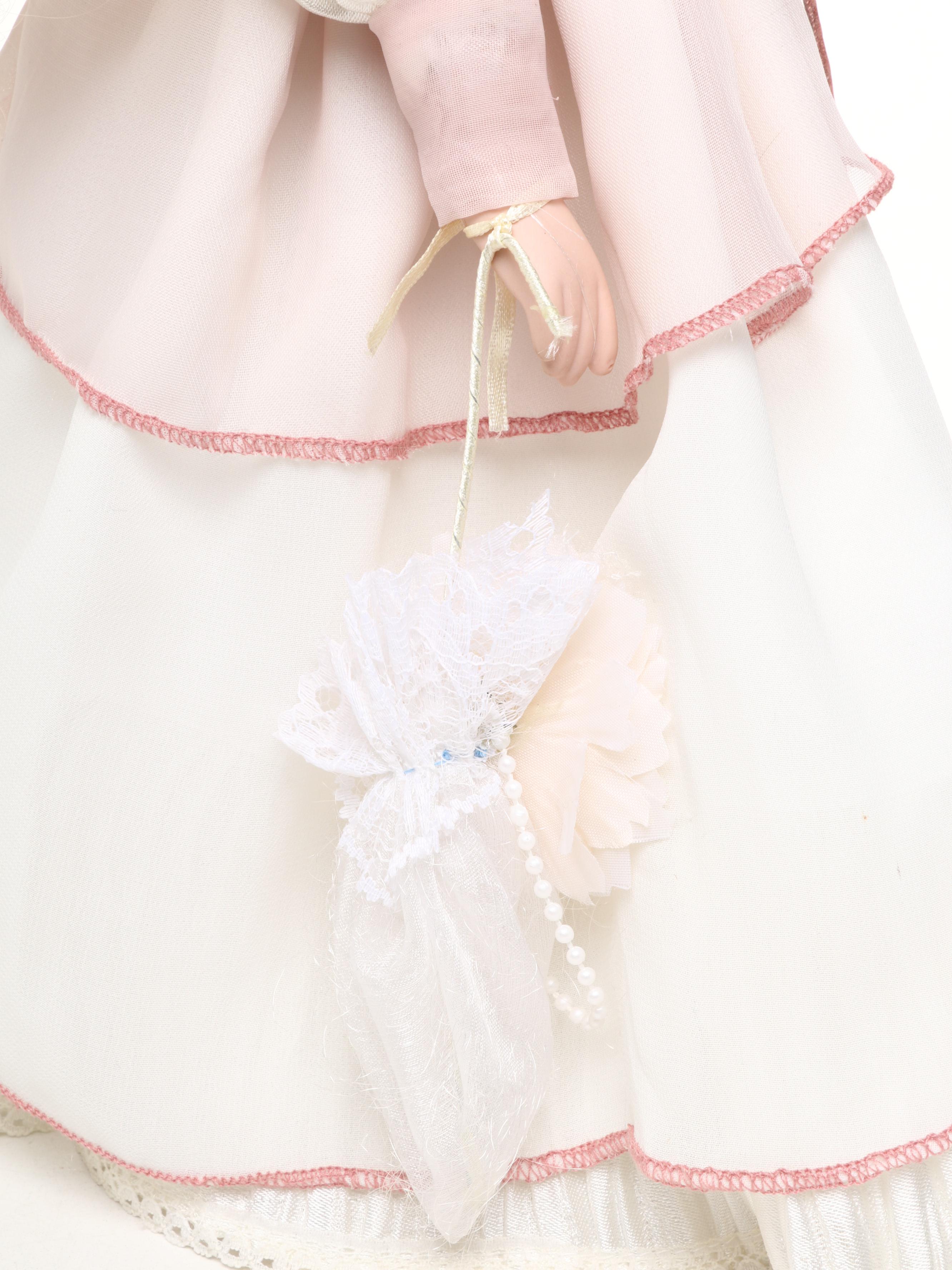 Pair of Emerald Doll Collection Porcelain Dolls, 2004