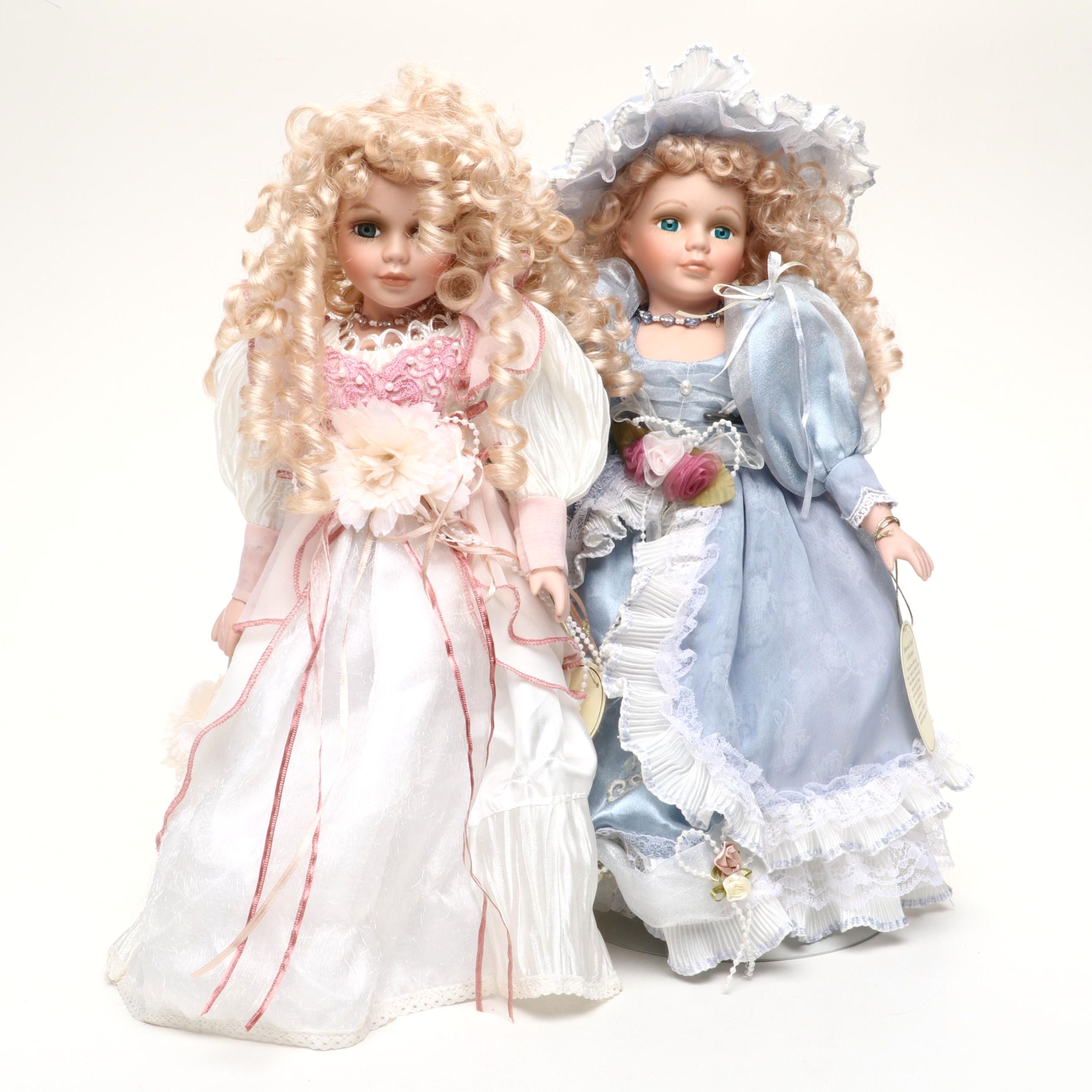 Pair of Emerald Doll Collection Porcelain Dolls, 2004