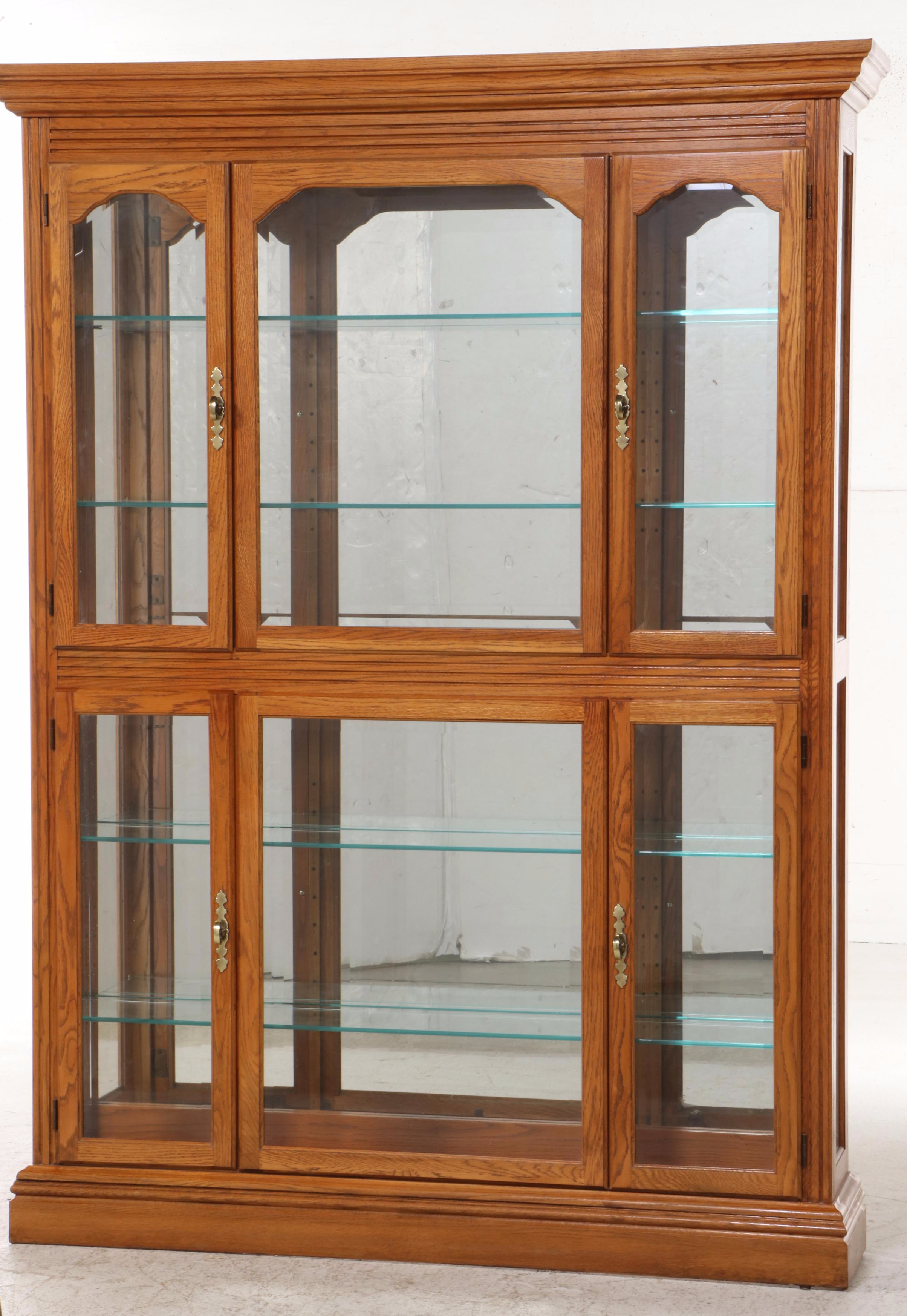 Pulaski Furniture Colonial Style Oak Illuminated Glass Front Curio Cabinet