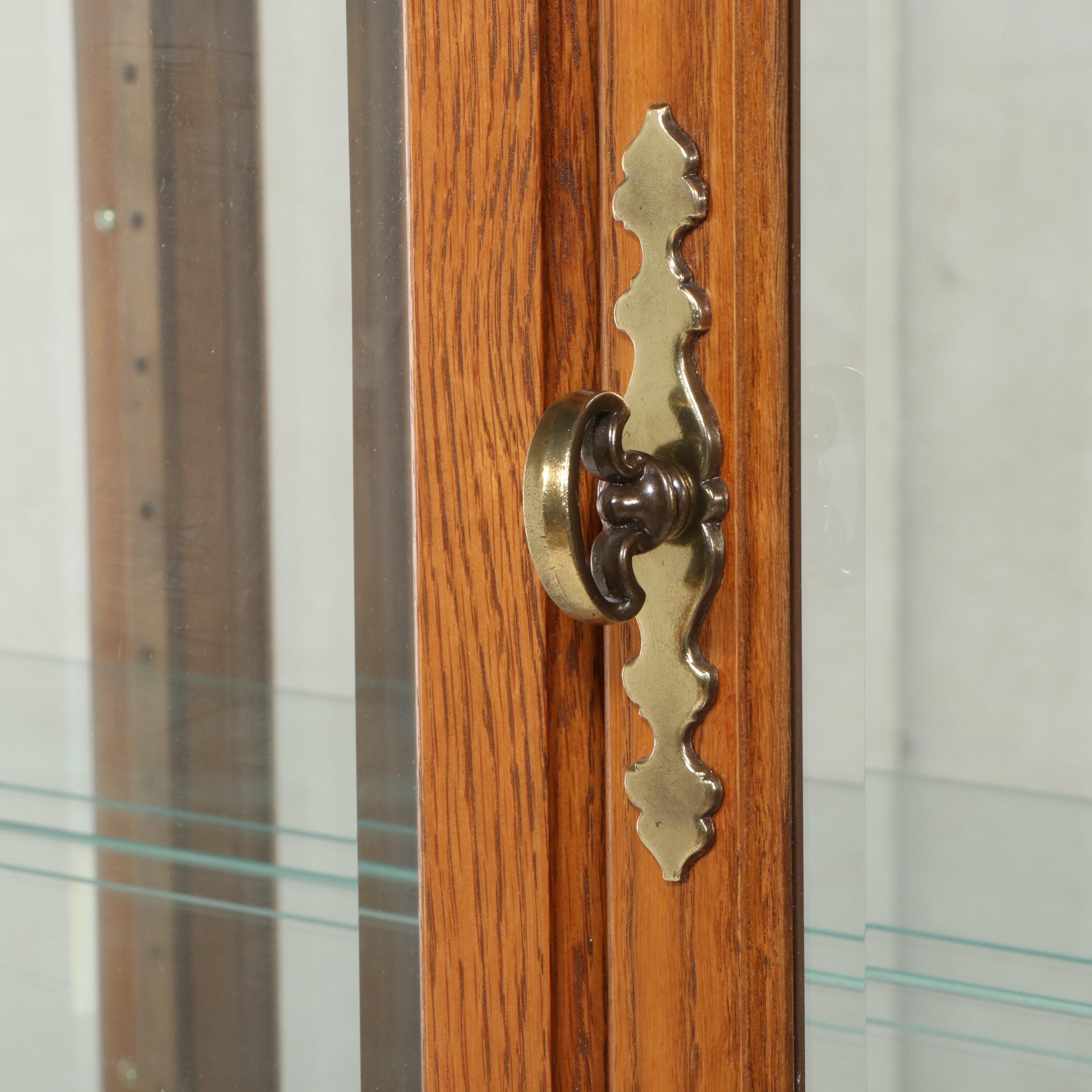 Pulaski Furniture Colonial Style Oak Illuminated Glass Front Curio Cabinet