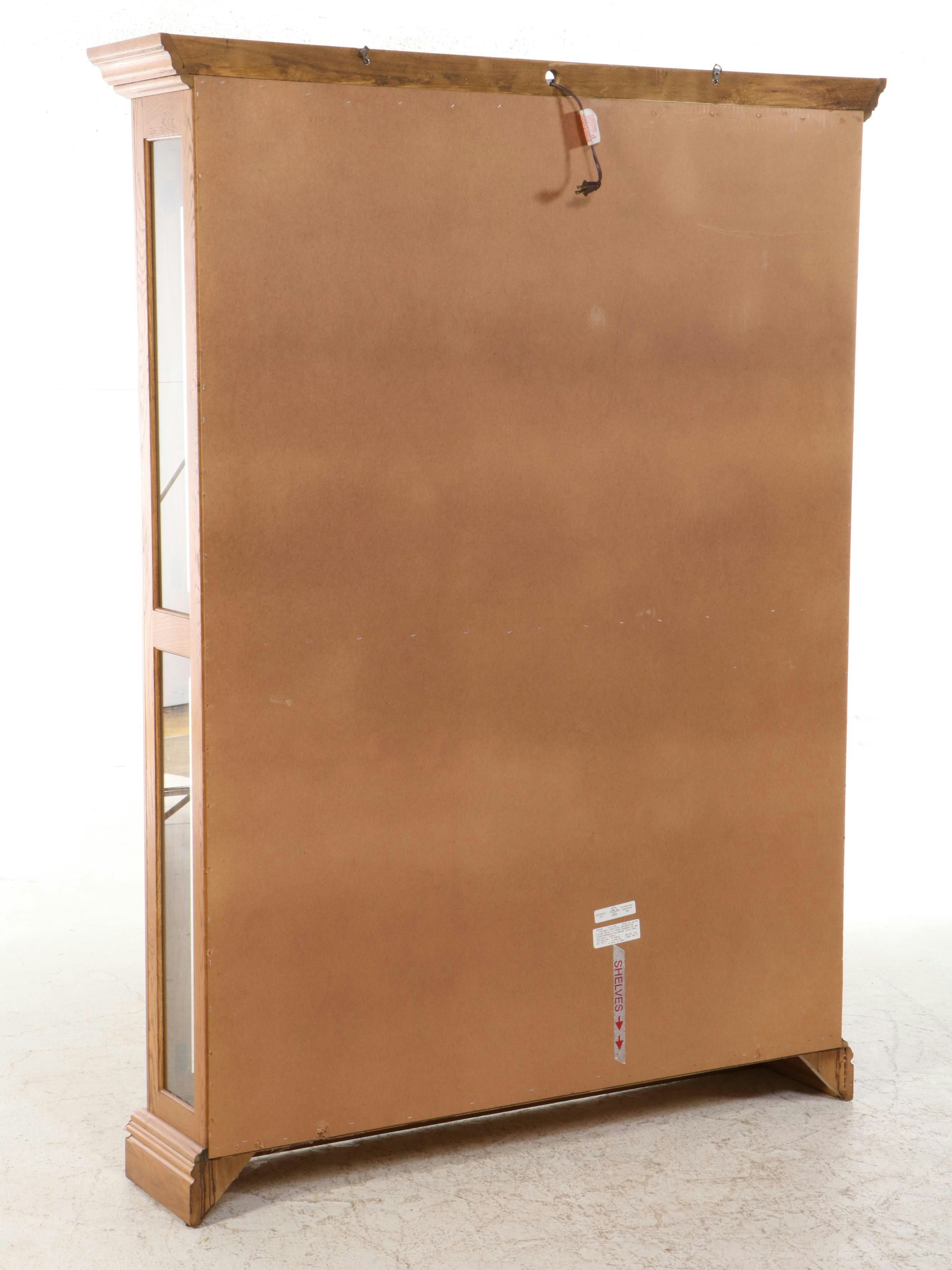 Pulaski Furniture Colonial Style Oak Illuminated Glass Front Curio Cabinet