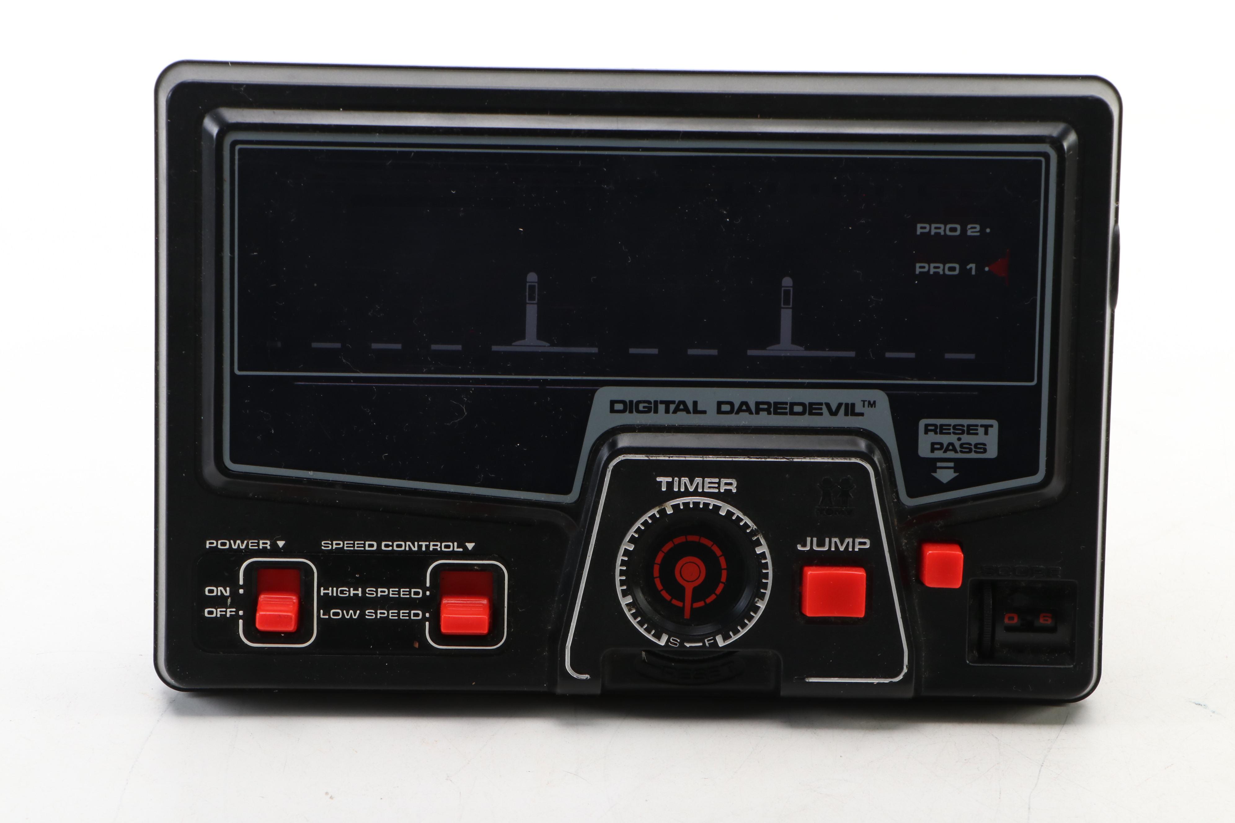 Coleco Pac-Man and Tomytronic Scramble with Other Mini-Arcade Games, 1980-1981