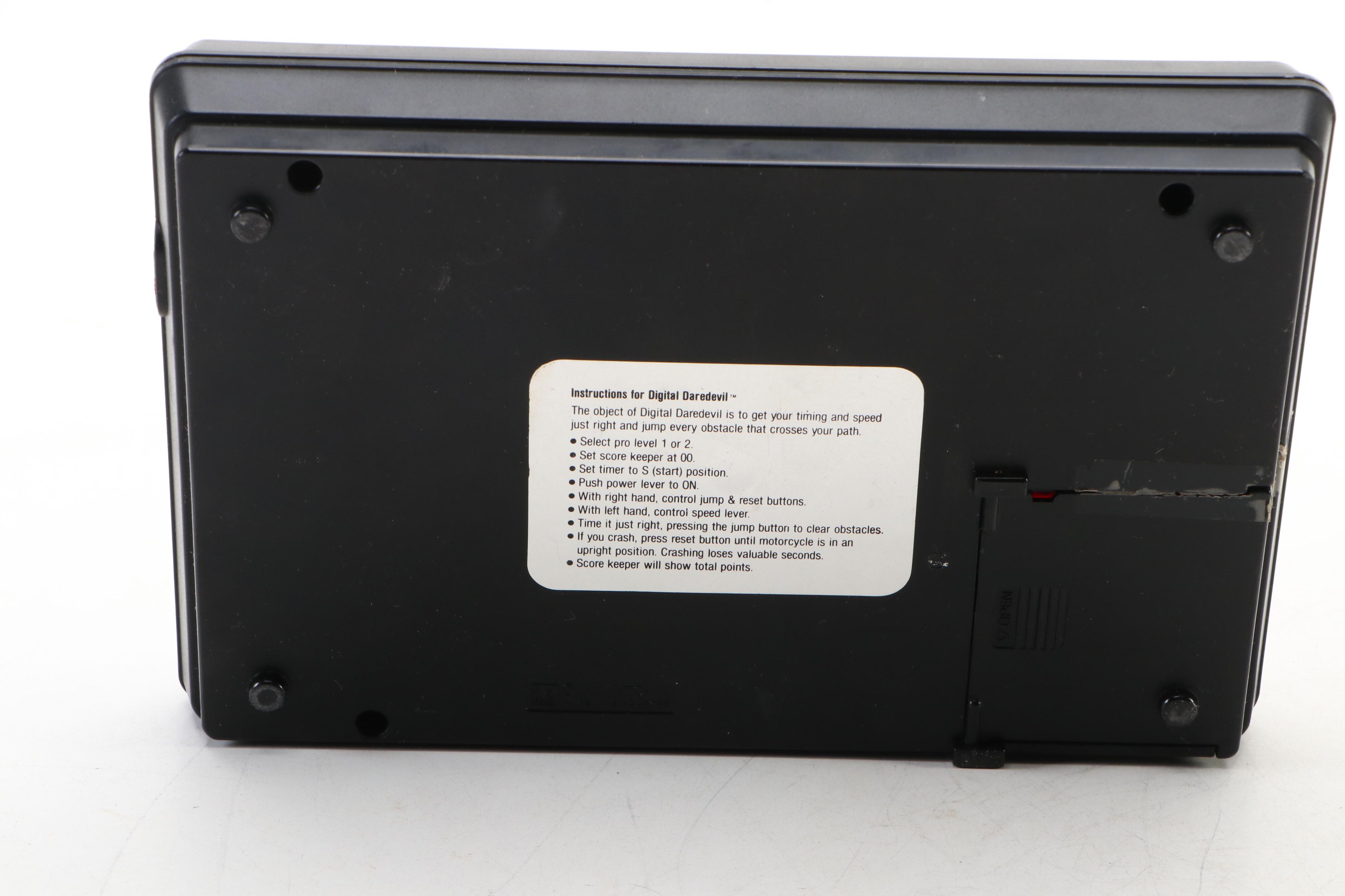 Coleco Pac-Man and Tomytronic Scramble with Other Mini-Arcade Games, 1980-1981