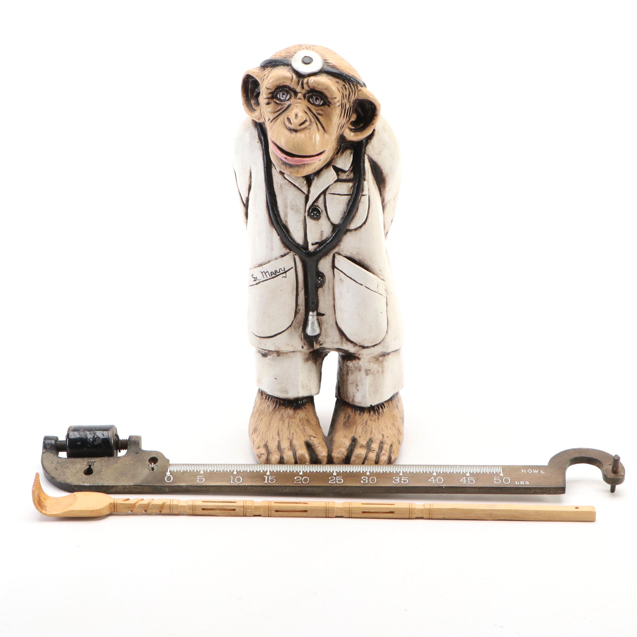 Resin Chimp Doctor with Howe Scale Arm and Carved Bamboo Back Scratcher