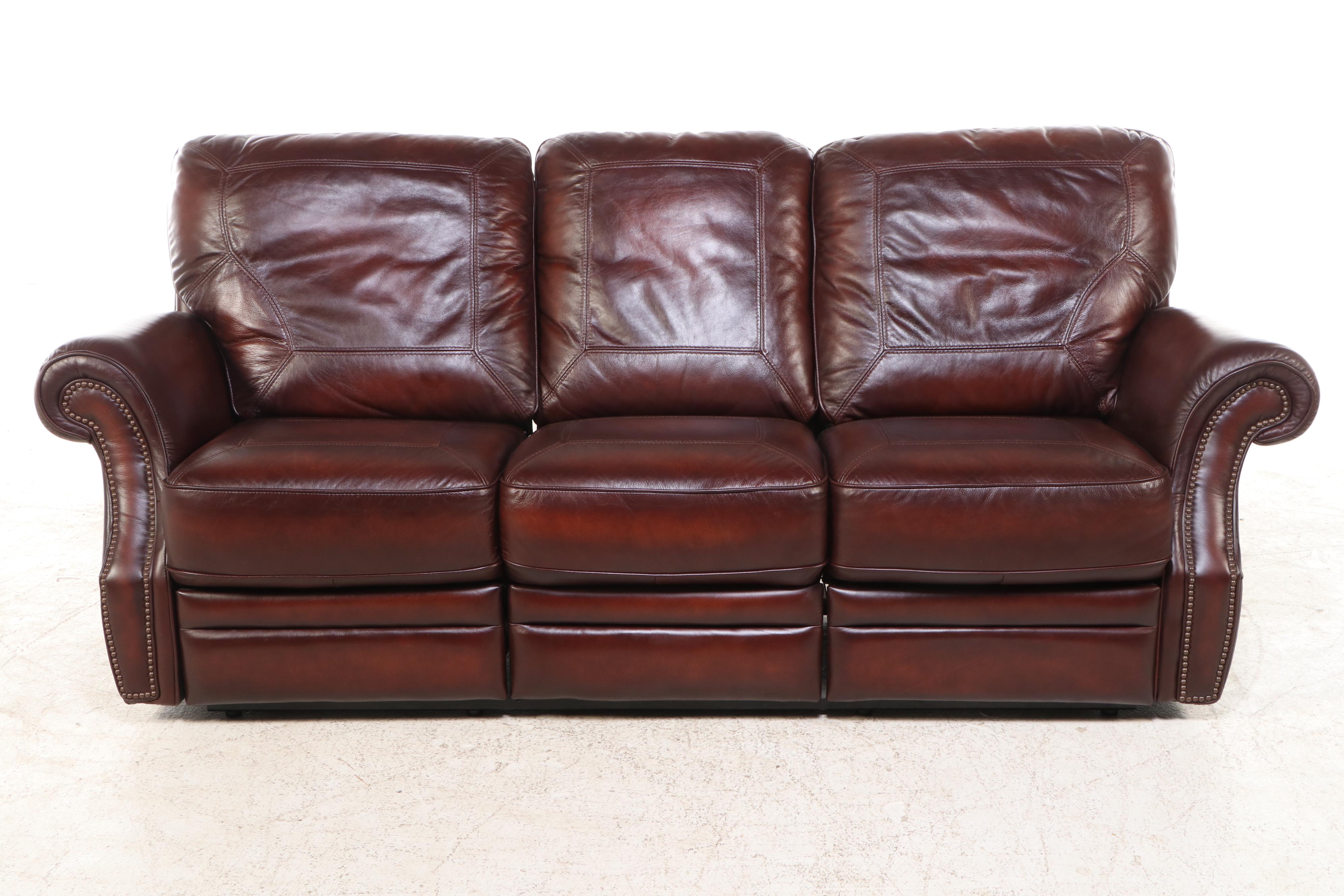 Leather Upholstered Reclining Sofa with Nailhead Trim
