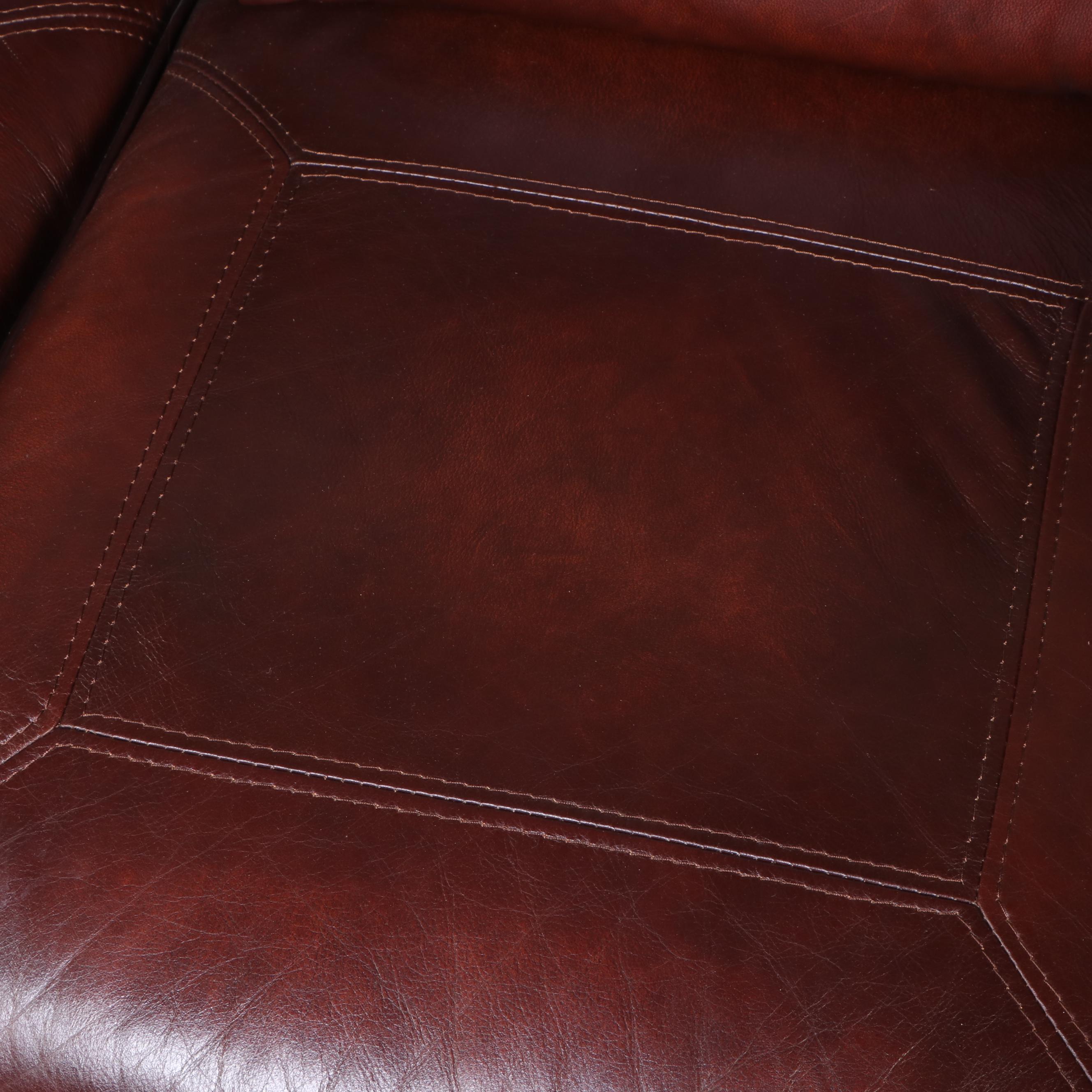 Leather Upholstered Reclining Sofa with Nailhead Trim