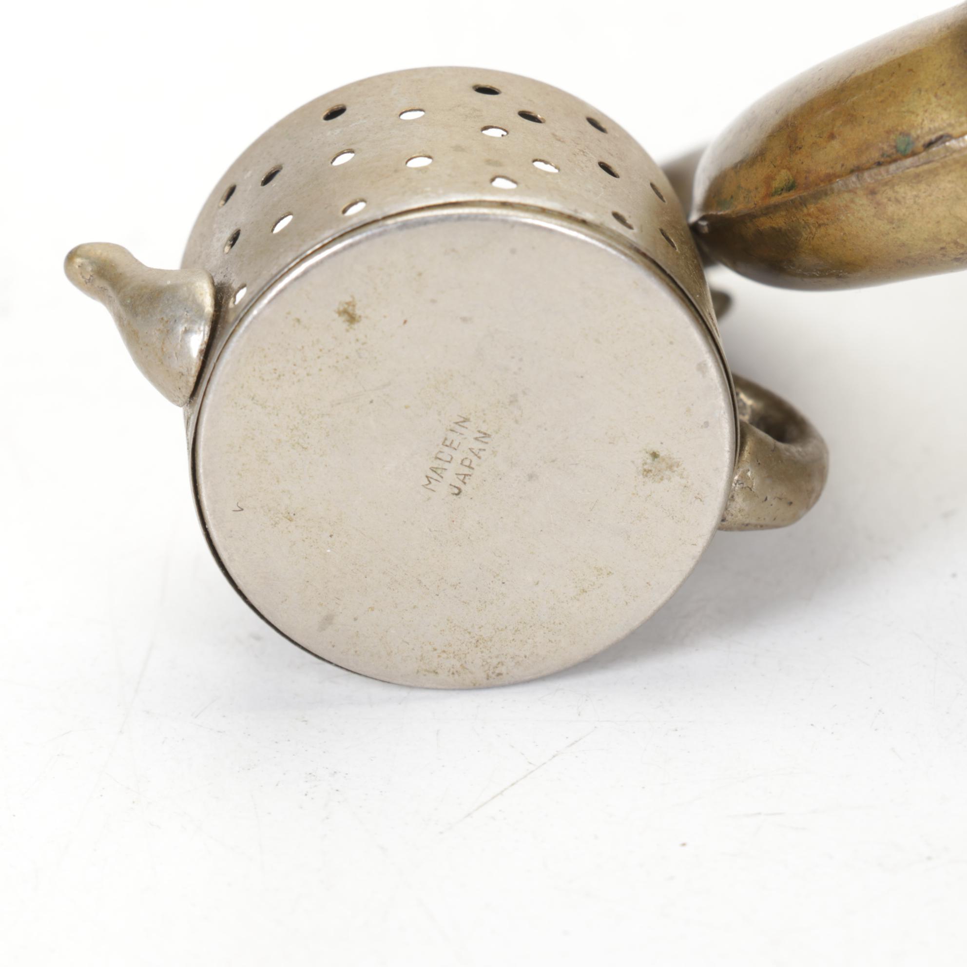 Brass Teapots include Etched Floral Motif, Wood Handles and Tea Strainer