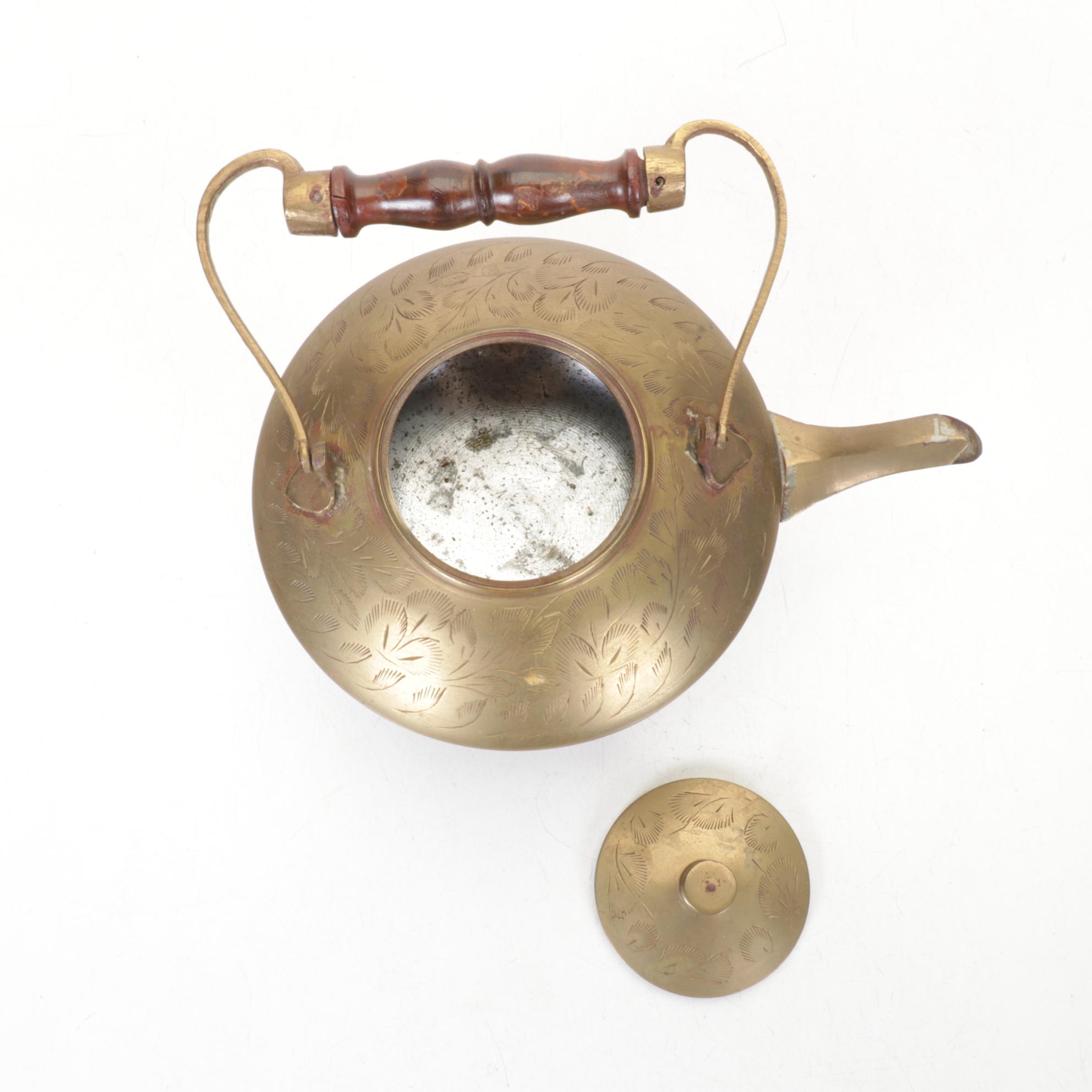 Brass and Metal Tea Kettles With Etched and Patterned Designs and Wooden Accents