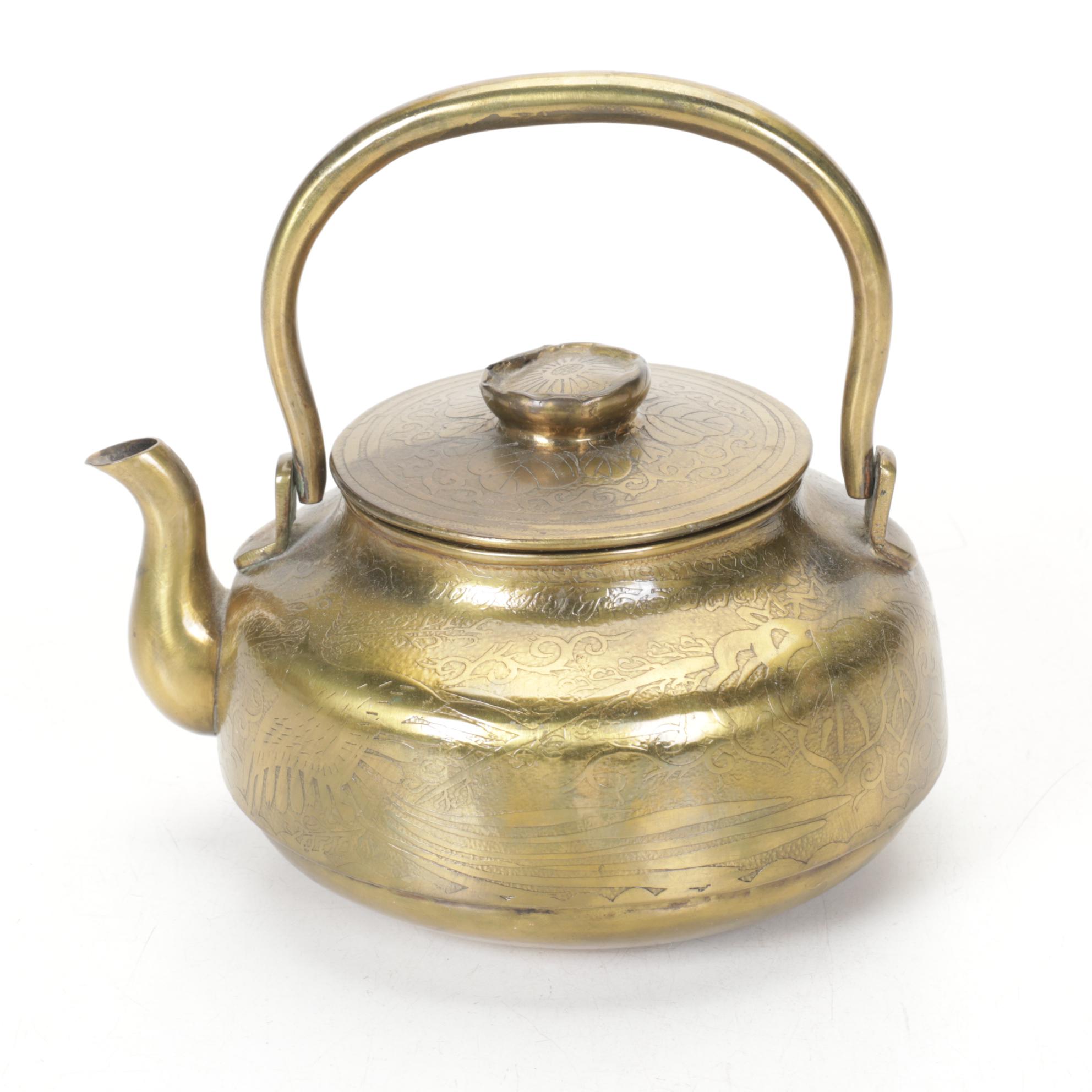 Brass and Metal Tea Kettles With Etched and Patterned Designs and Wooden Accents