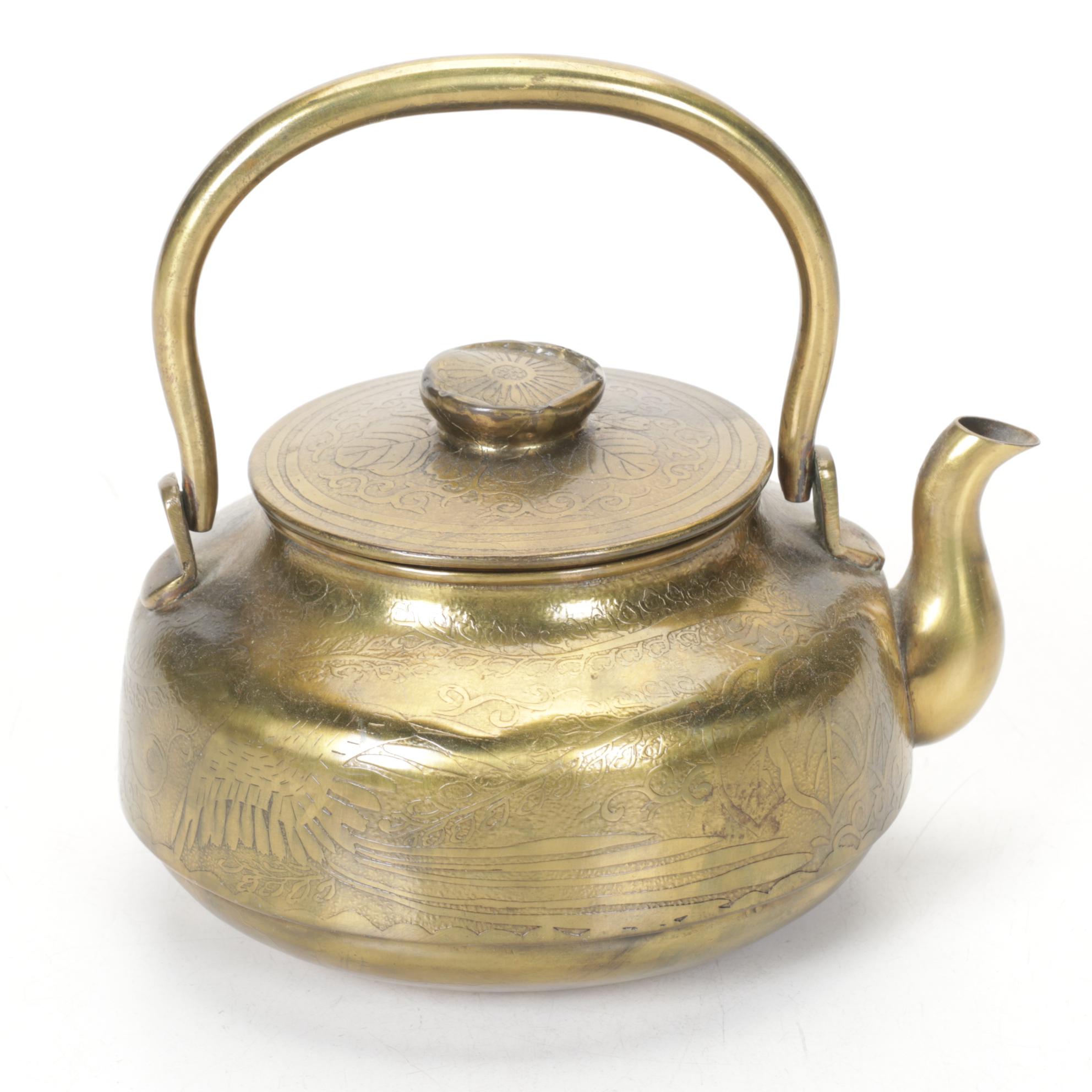 Brass and Metal Tea Kettles With Etched and Patterned Designs and Wooden Accents