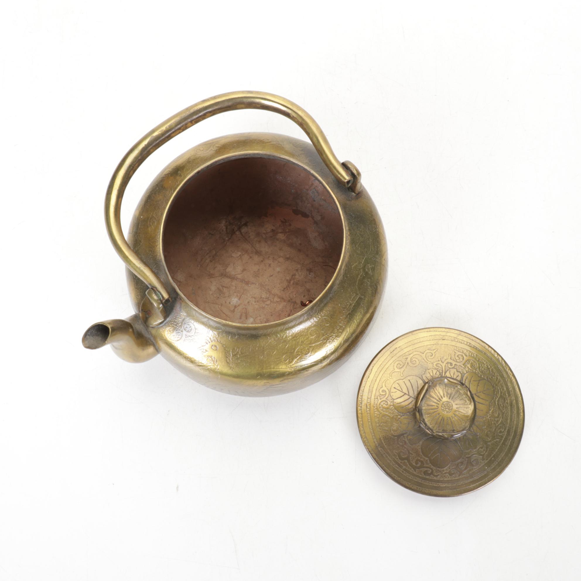 Brass and Metal Tea Kettles With Etched and Patterned Designs and Wooden Accents