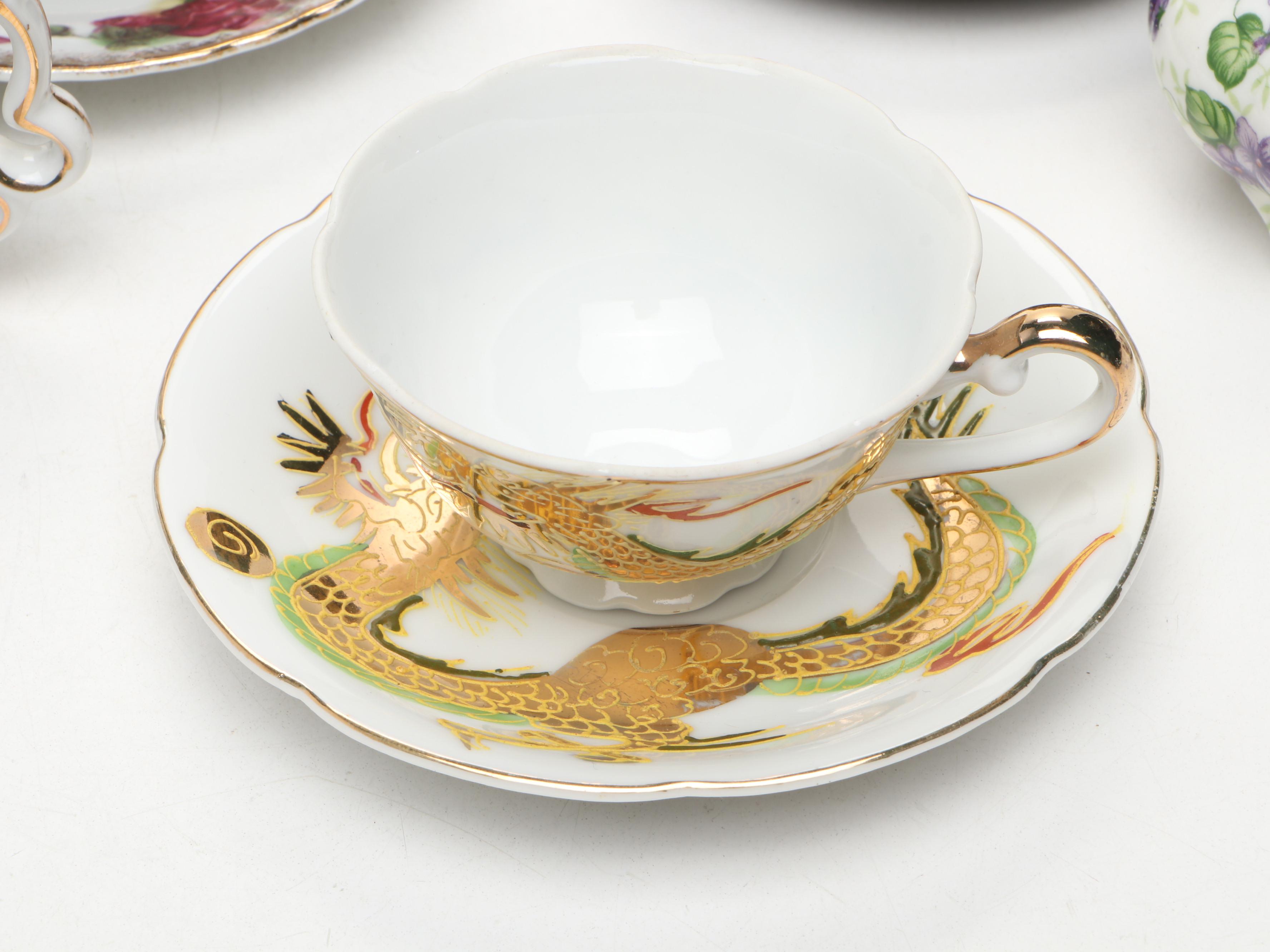 Hand Painted Delft Blue Porcelain Teacup and Saucer with More