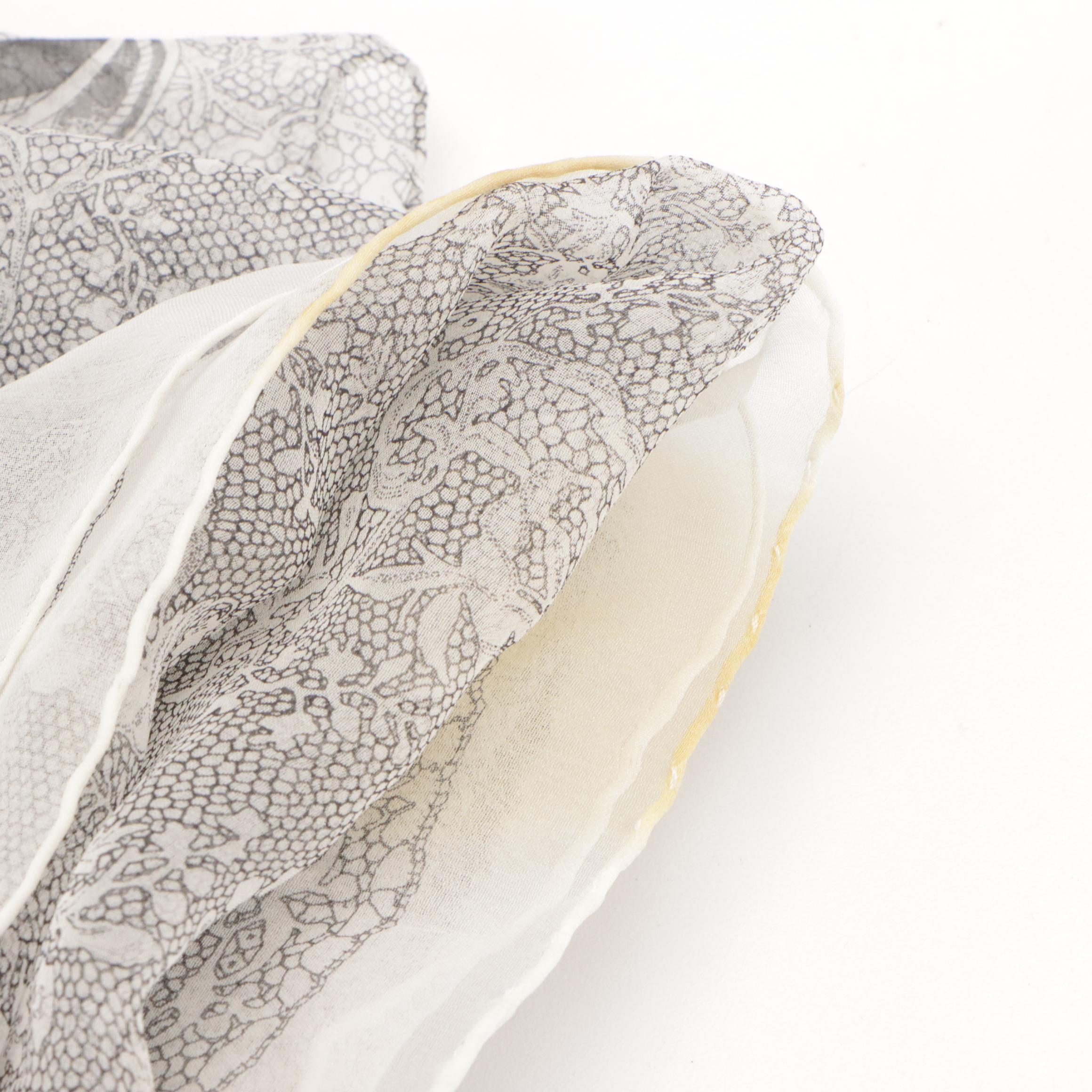 Polo Ralph Lauren, Salvatore Ferragamo, and Burberrys Silk Scarves with More