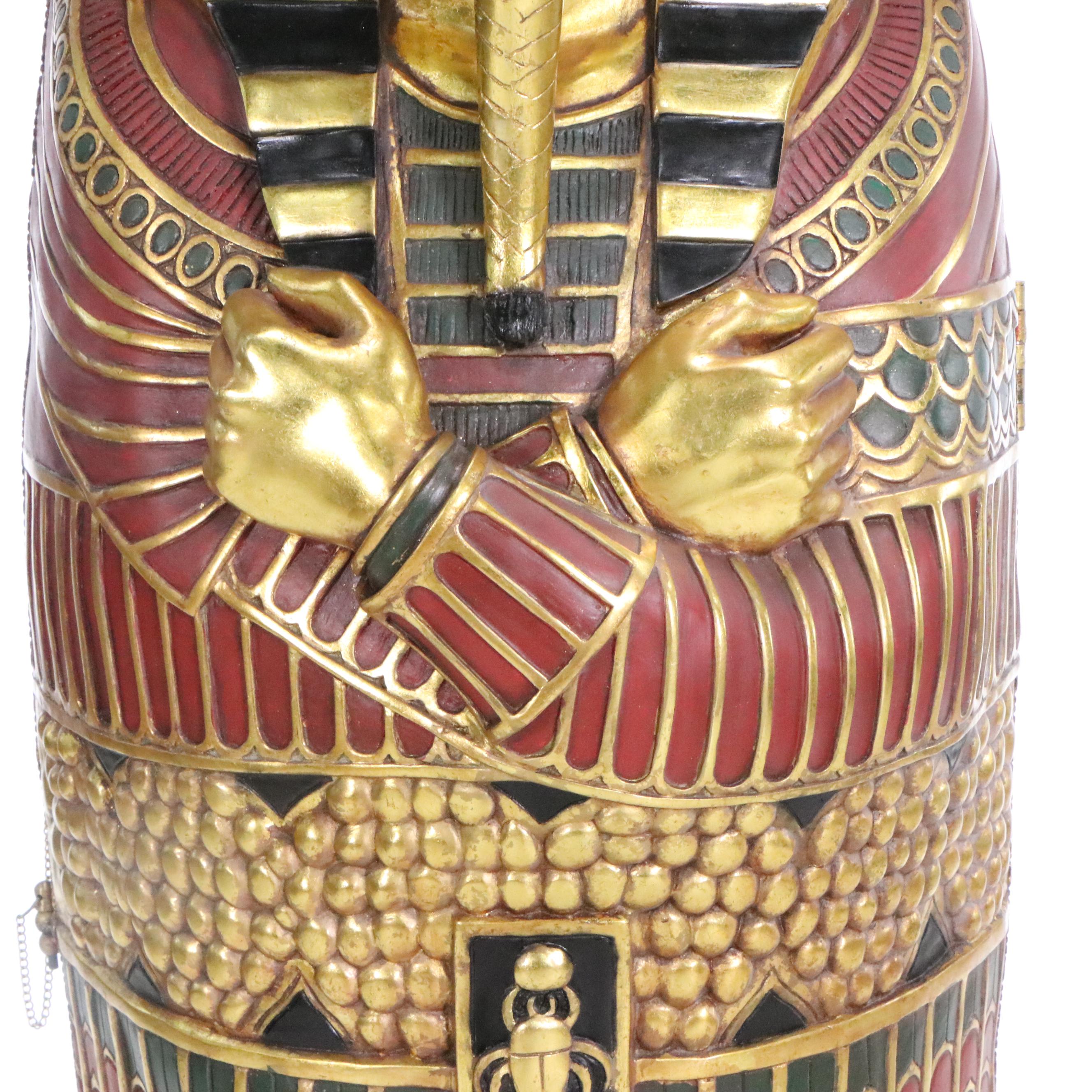 Egyptian Revival Style Parcel-Gilt and Paint-Decorated Sarcophagus-Form Cabinet