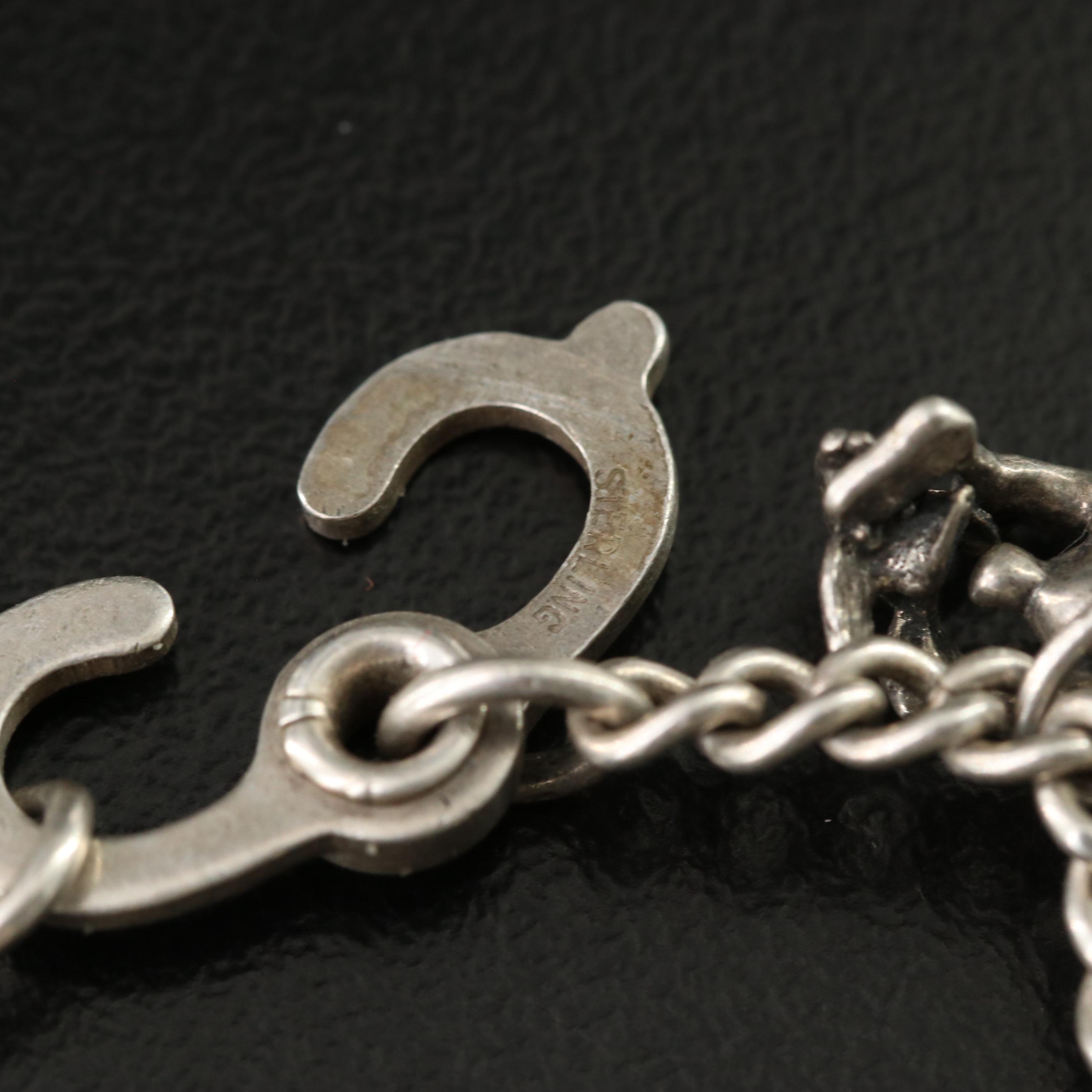 Vintage Charm Bracelets Featuring Sterling and Articulated Charms