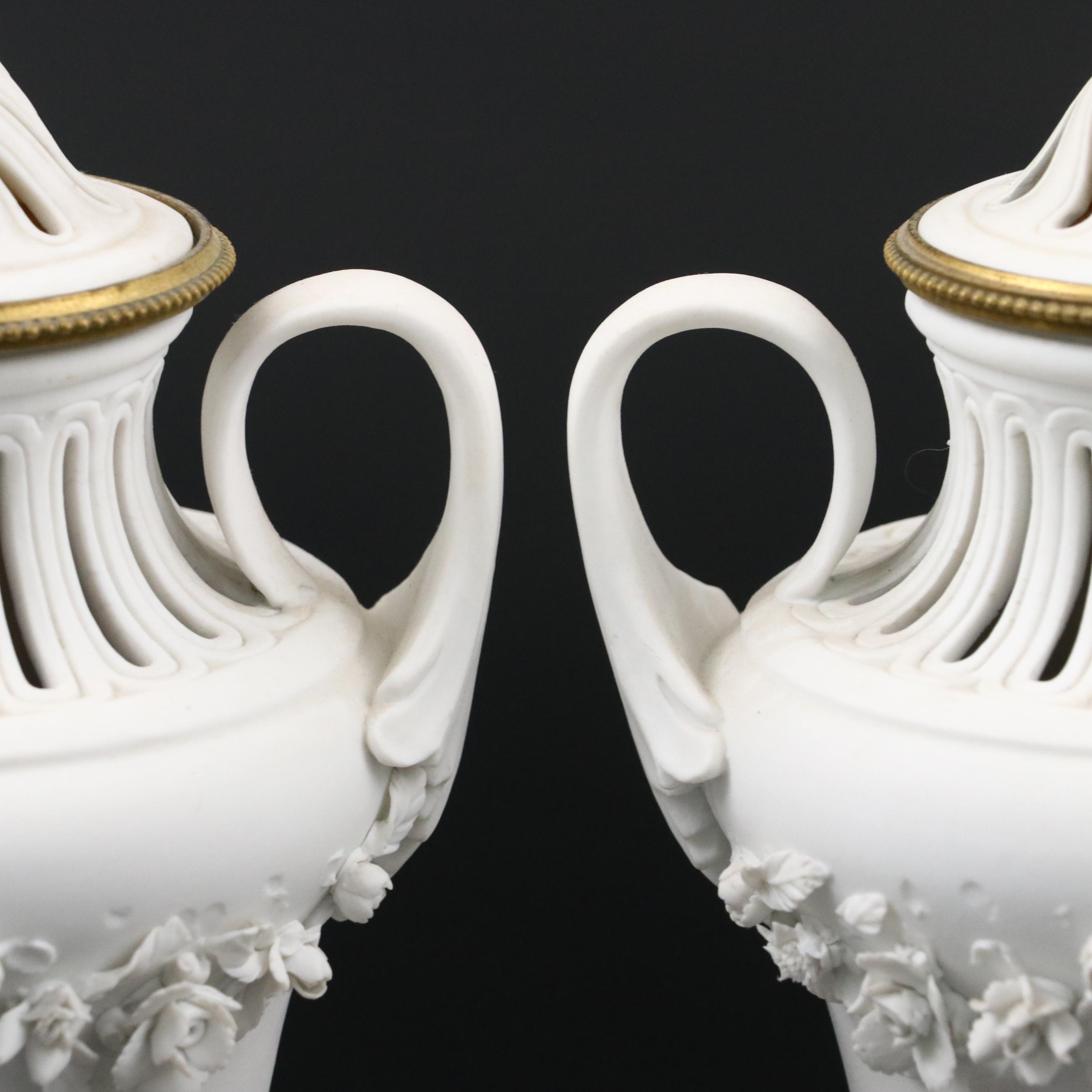 Pair of French Style Ormolu Mounted Bisque Covered Vases with Applied Rose Swags