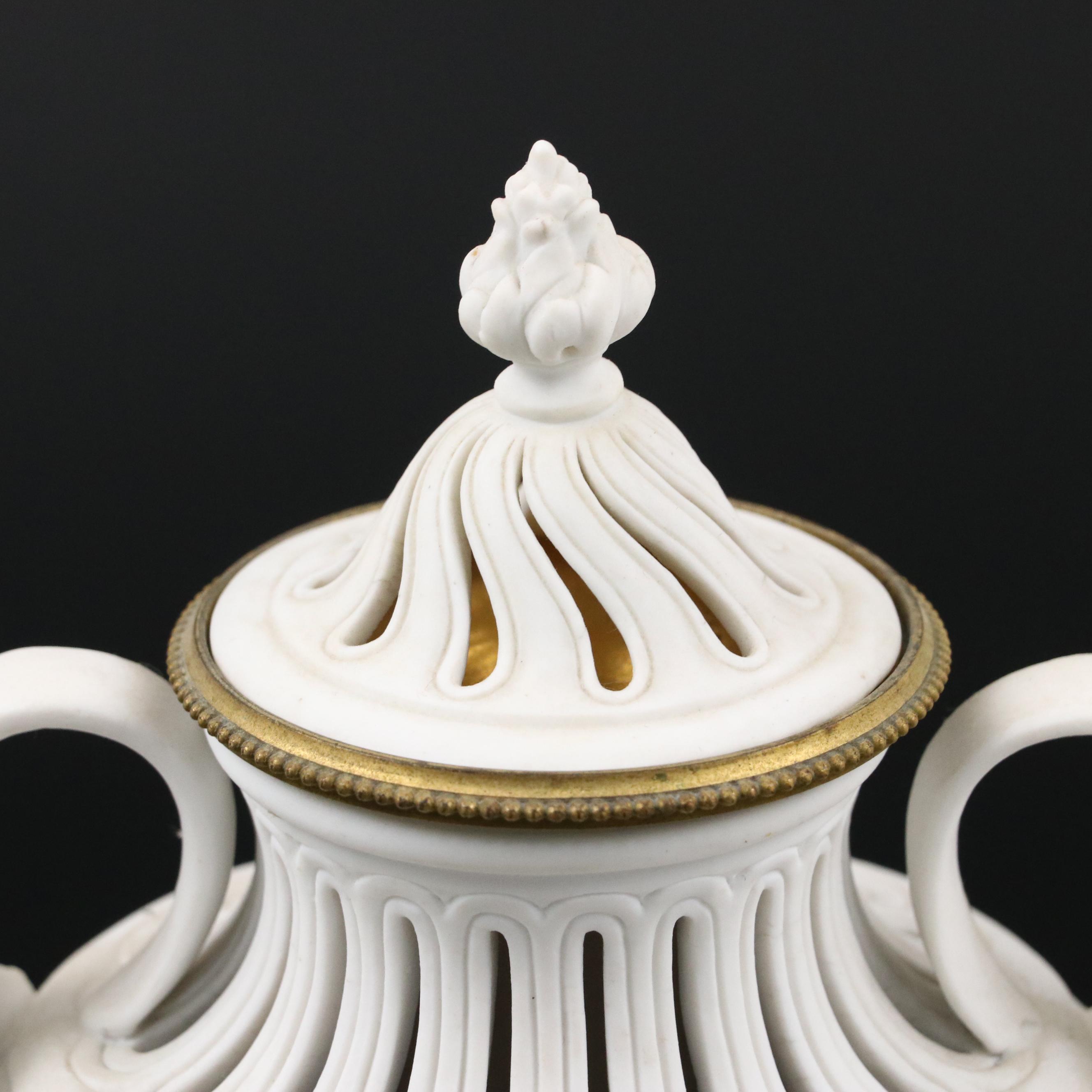 Pair of French Style Ormolu Mounted Bisque Covered Vases with Applied Rose Swags