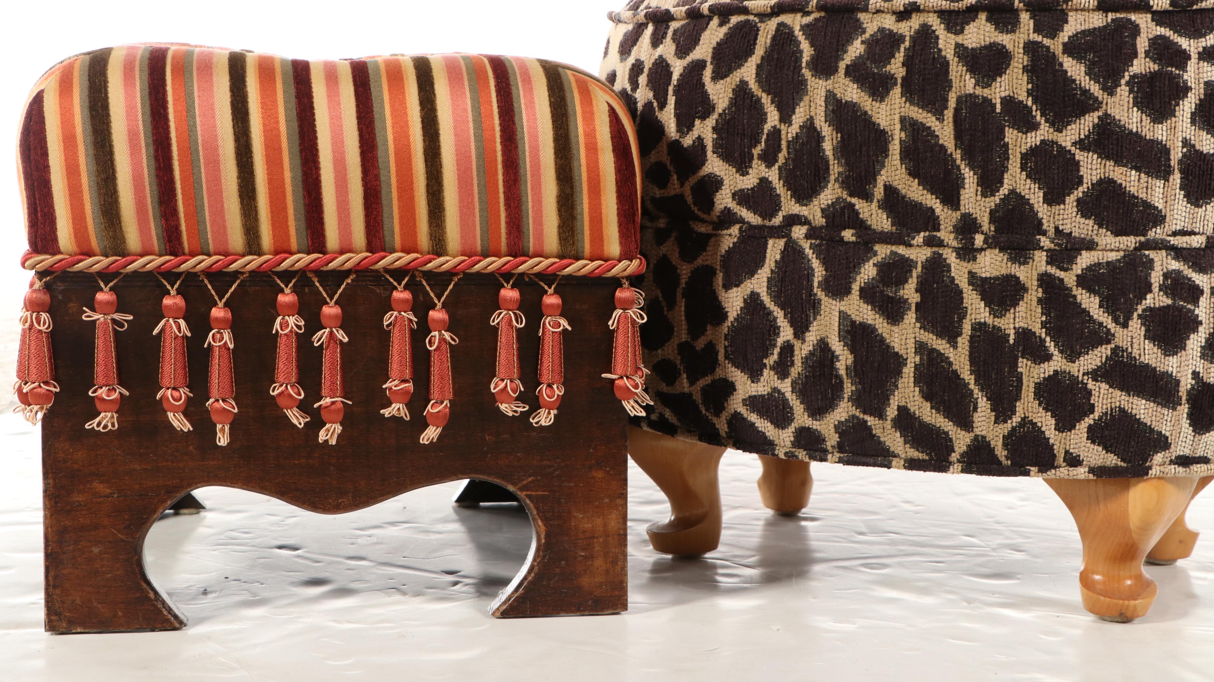 Two Upholstered Wood Footstools Featuring Animal Print and Tassels