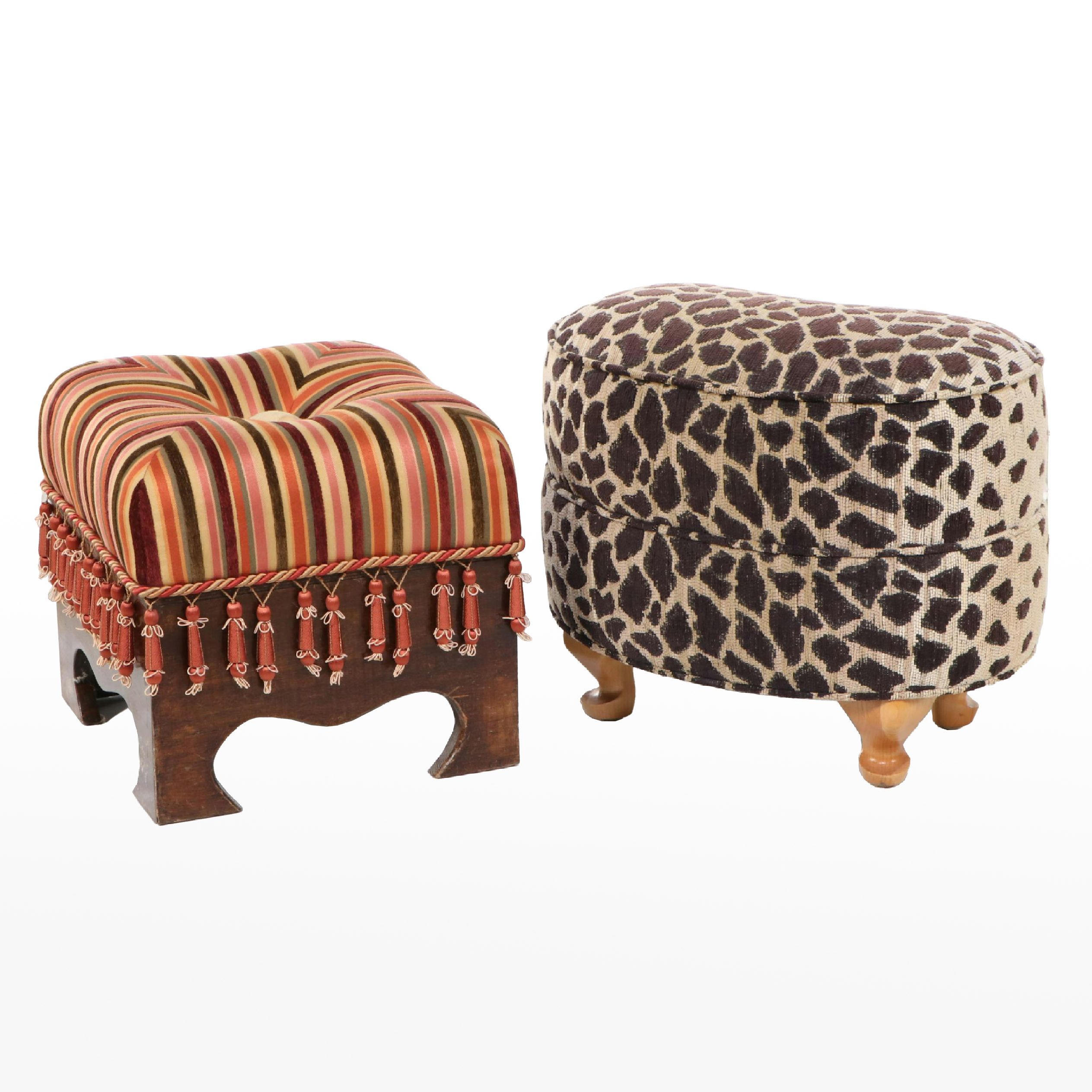 Two Upholstered Wood Footstools Featuring Animal Print and Tassels