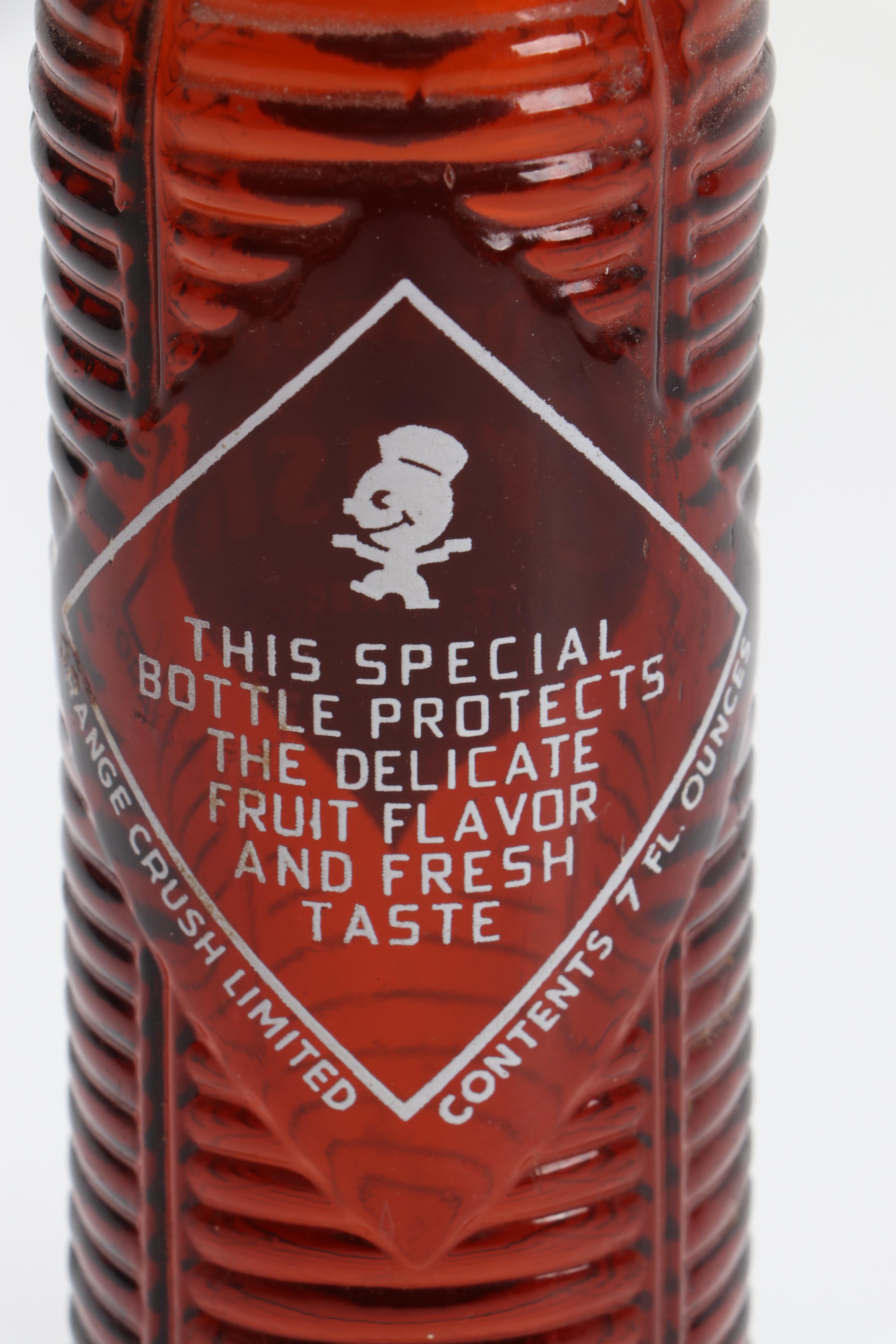 Orange Abstract Swirl Sculpture with Orange Crush Beehive Bottle