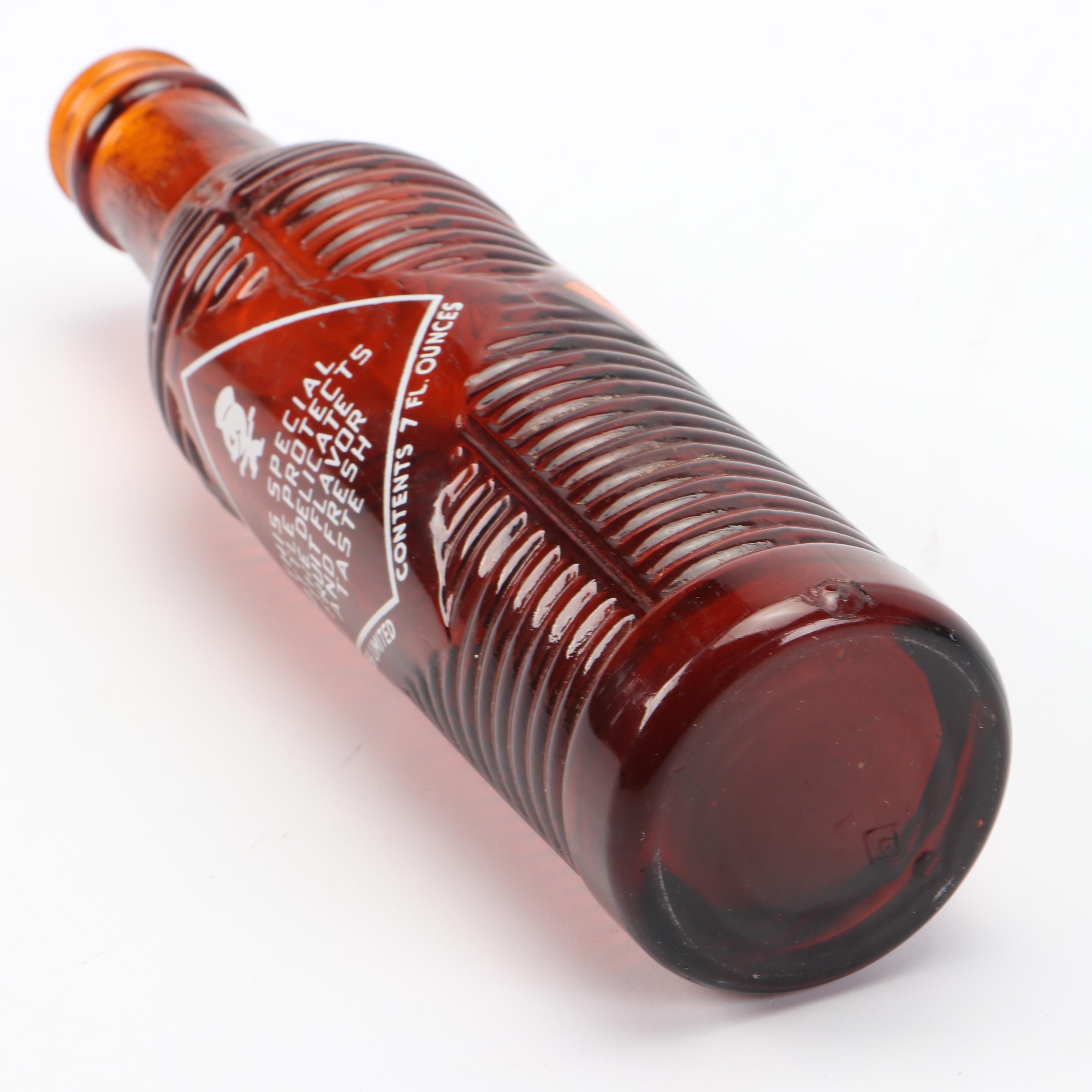 Orange Abstract Swirl Sculpture with Orange Crush Beehive Bottle