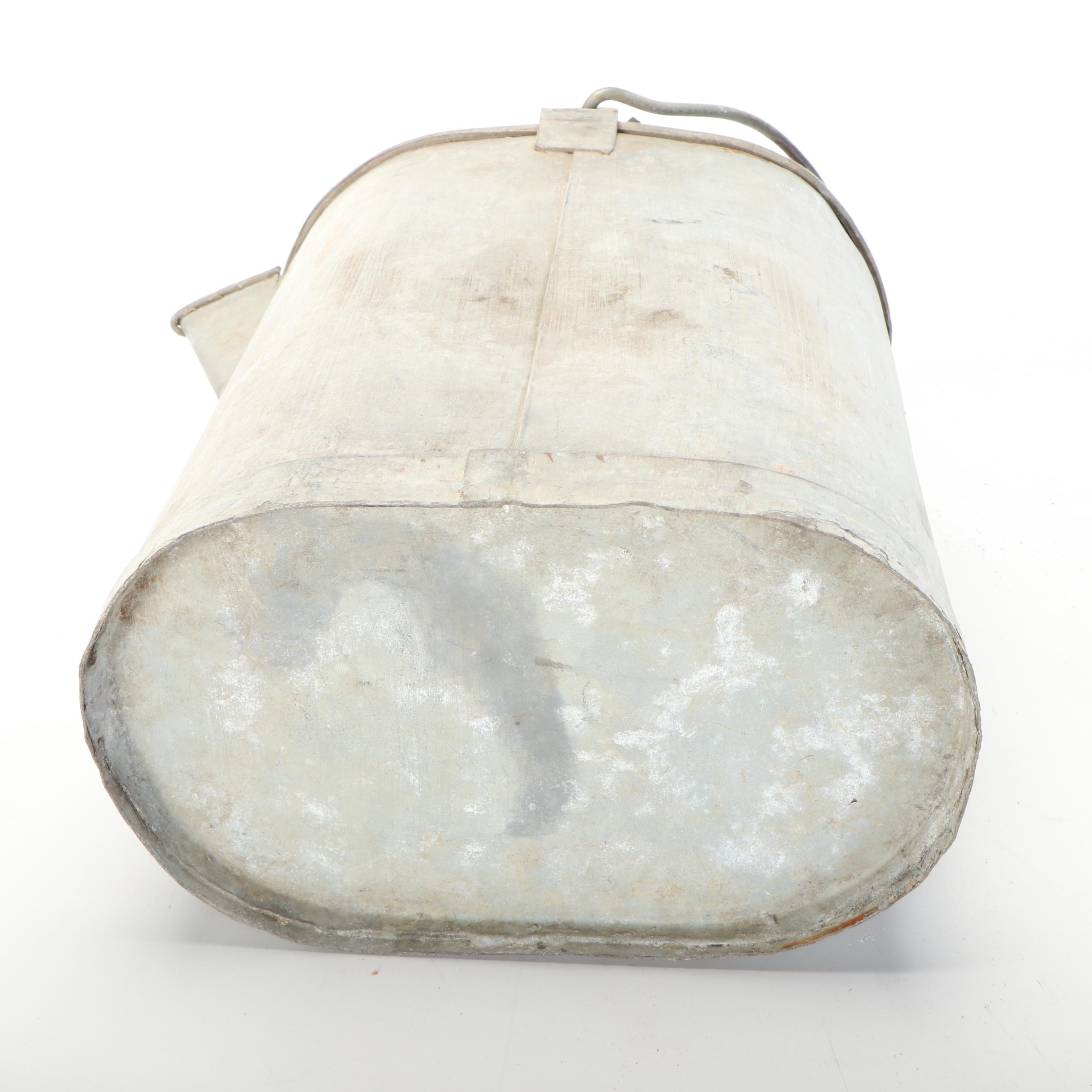 Four Metal Watering Cans