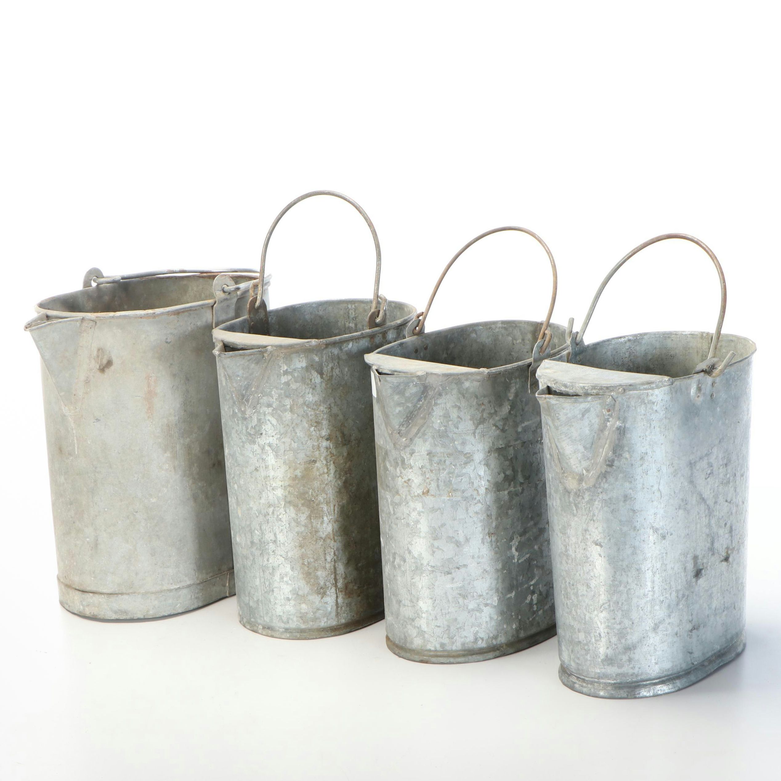Four Metal Watering Cans
