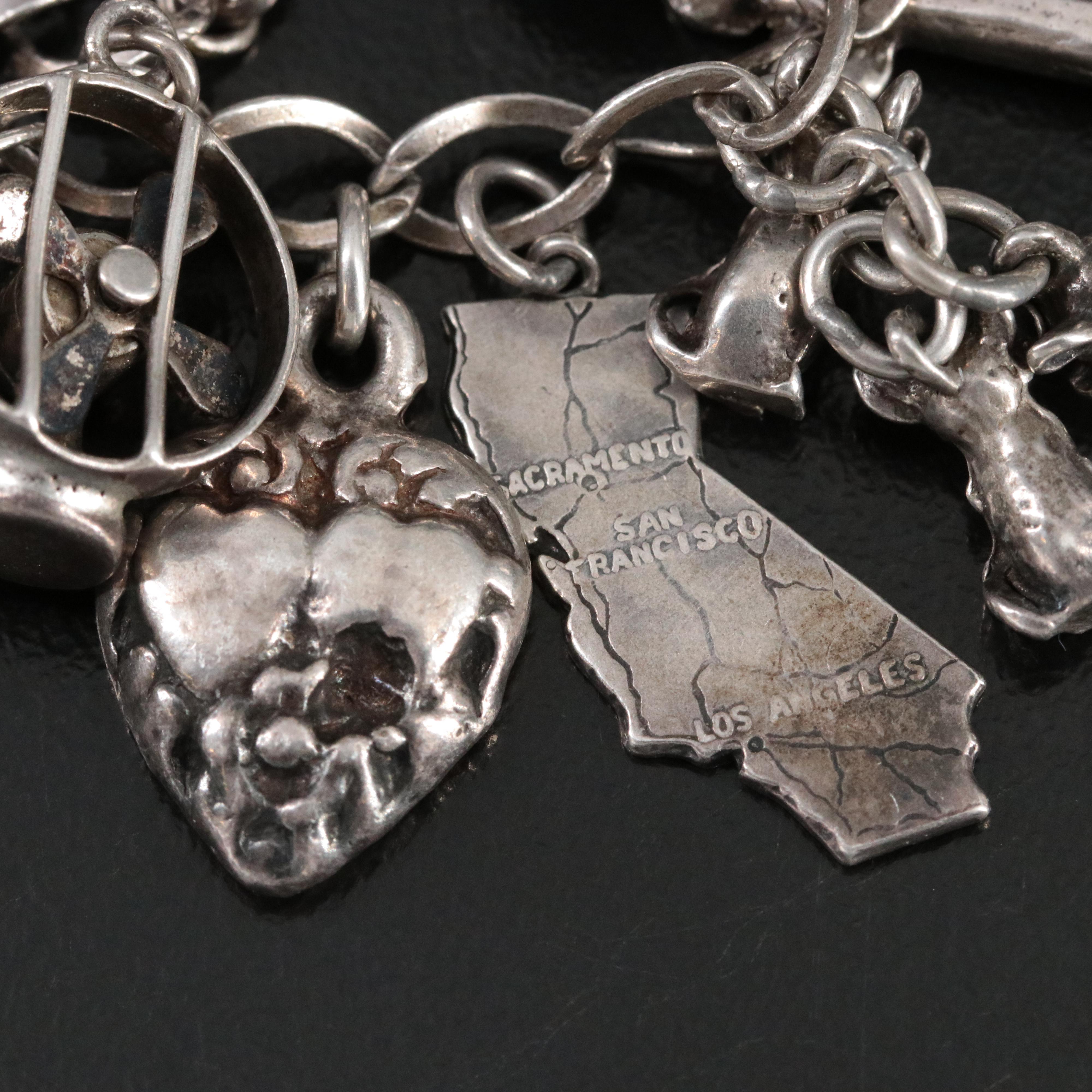 Vintage Charm Bracelet Featuring Sterling and Articulated Charms