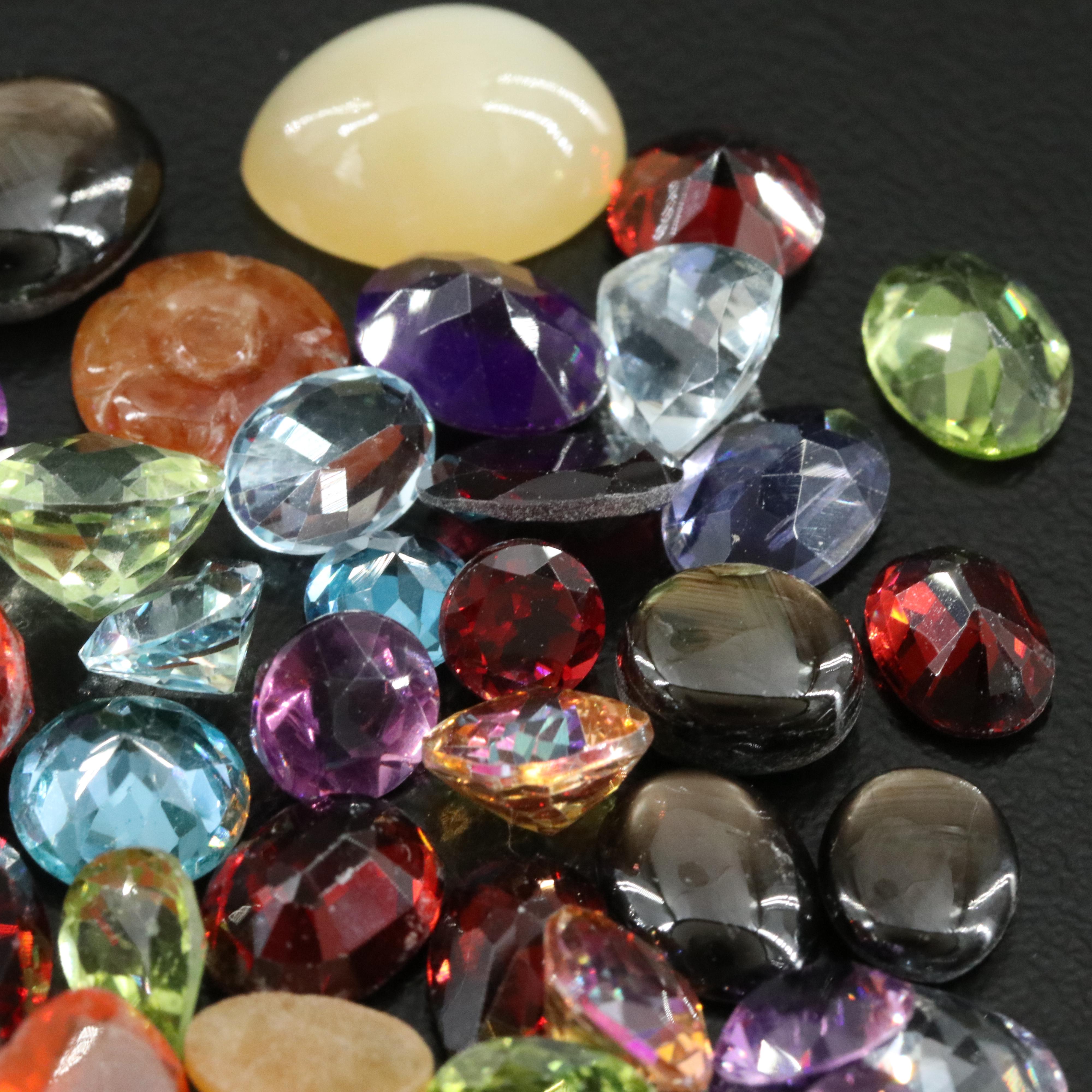 Loose Gemstone Lot Including Rutilated Quartz, Iolite and Peridot