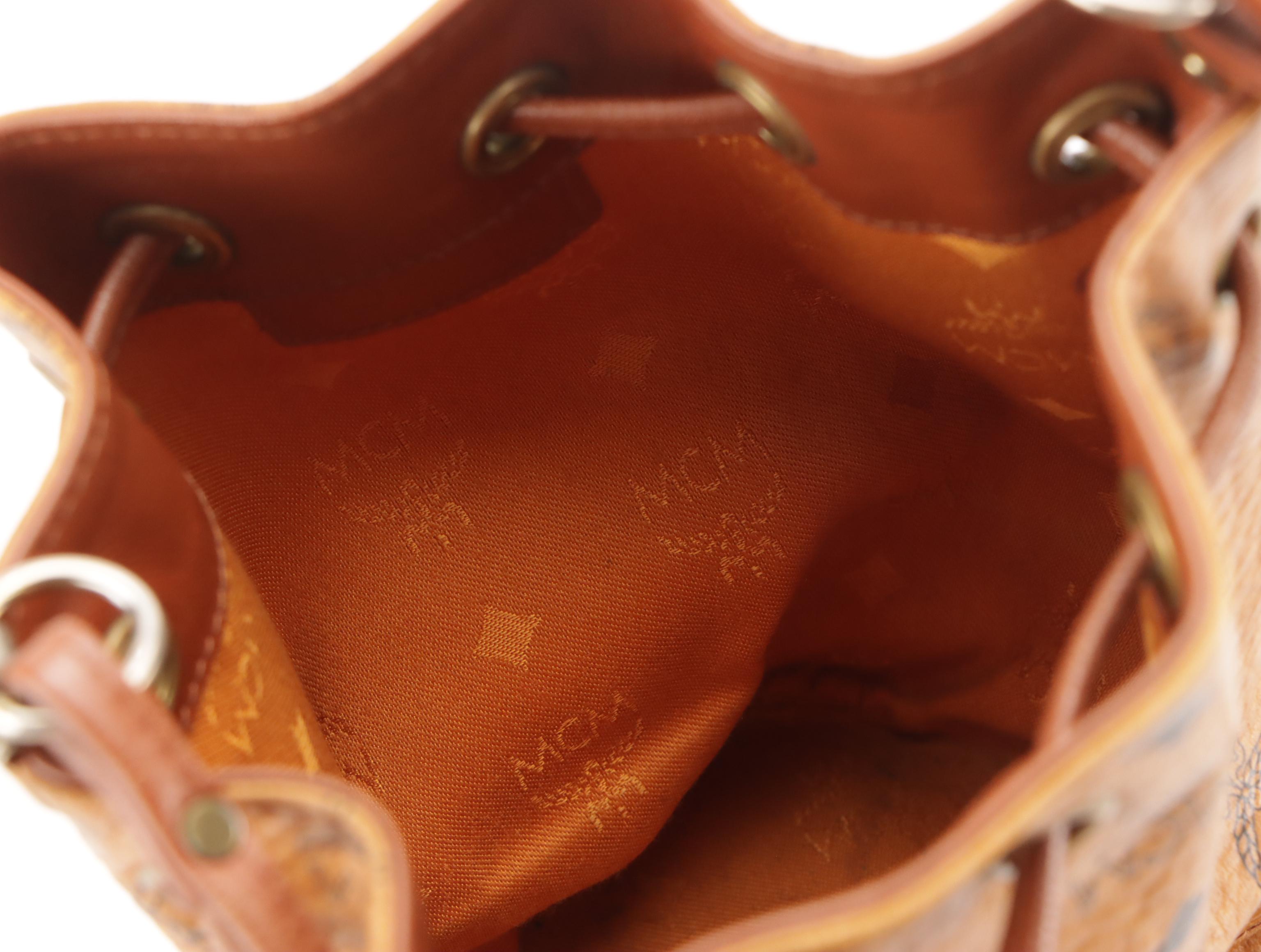 MCM Mini Drawstring Bucket Bag in Cognac Visetos Canvas with Leather Trim