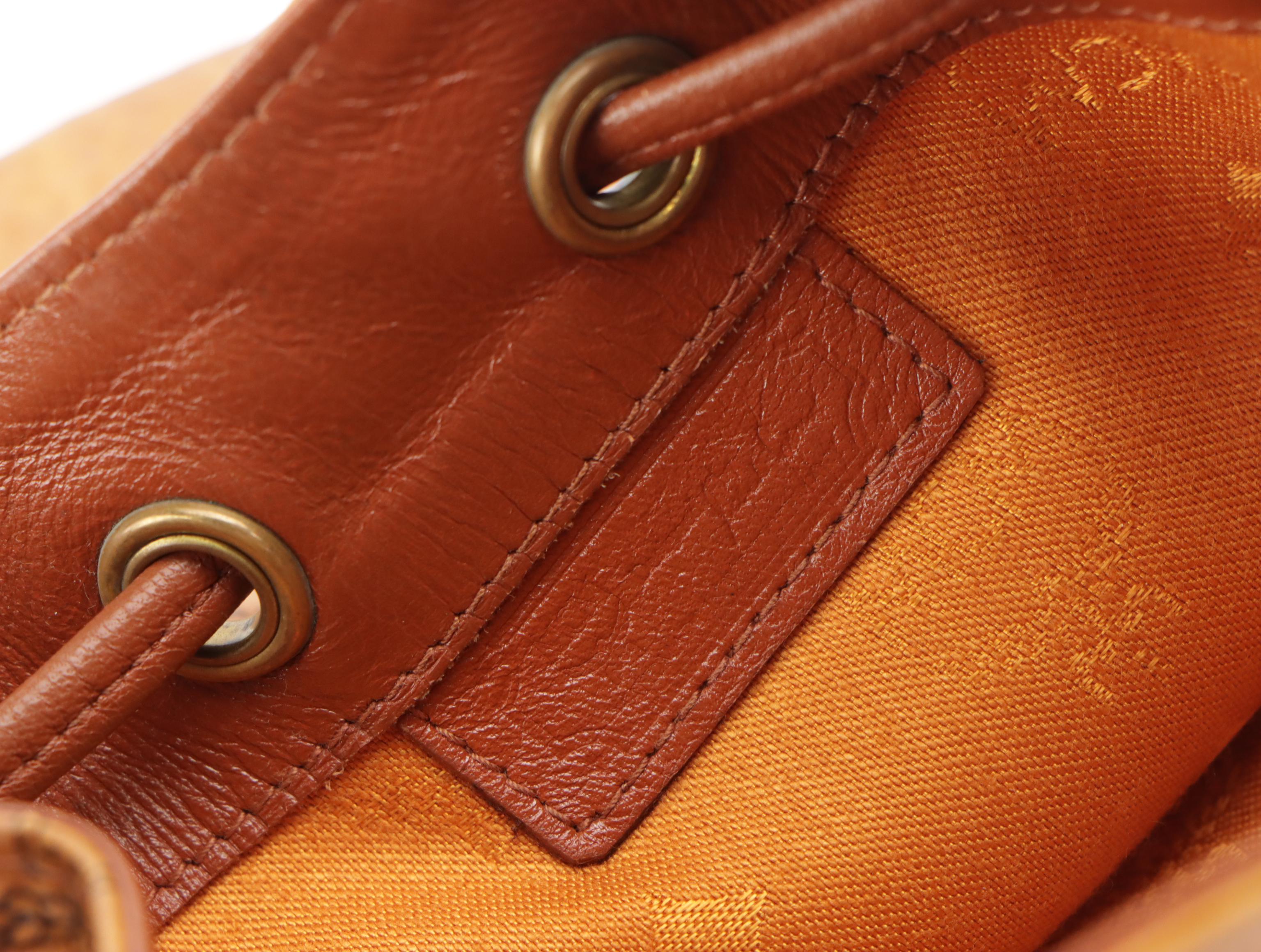 MCM Mini Drawstring Bucket Bag in Cognac Visetos Canvas with Leather Trim