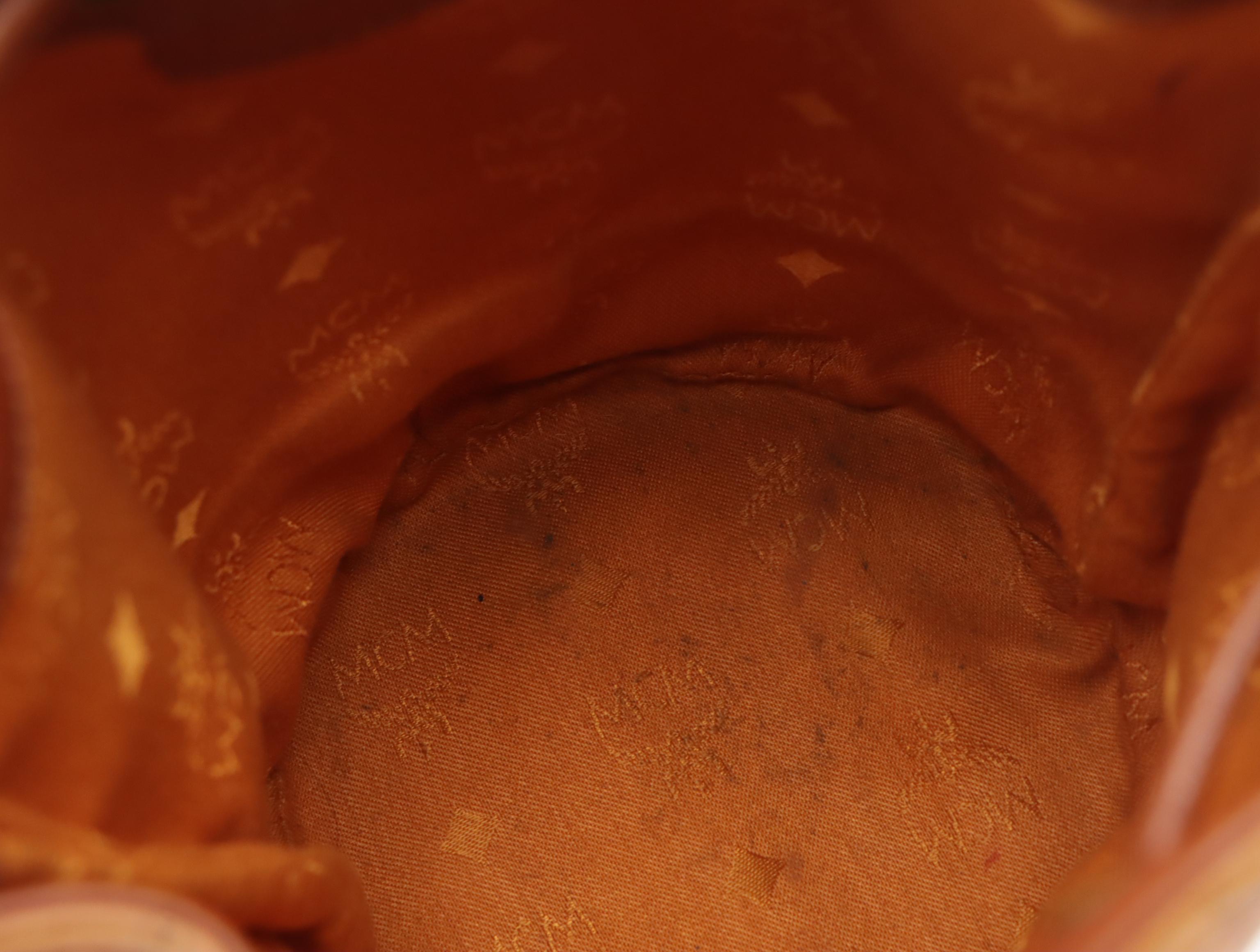 MCM Mini Drawstring Bucket Bag in Cognac Visetos Canvas with Leather Trim