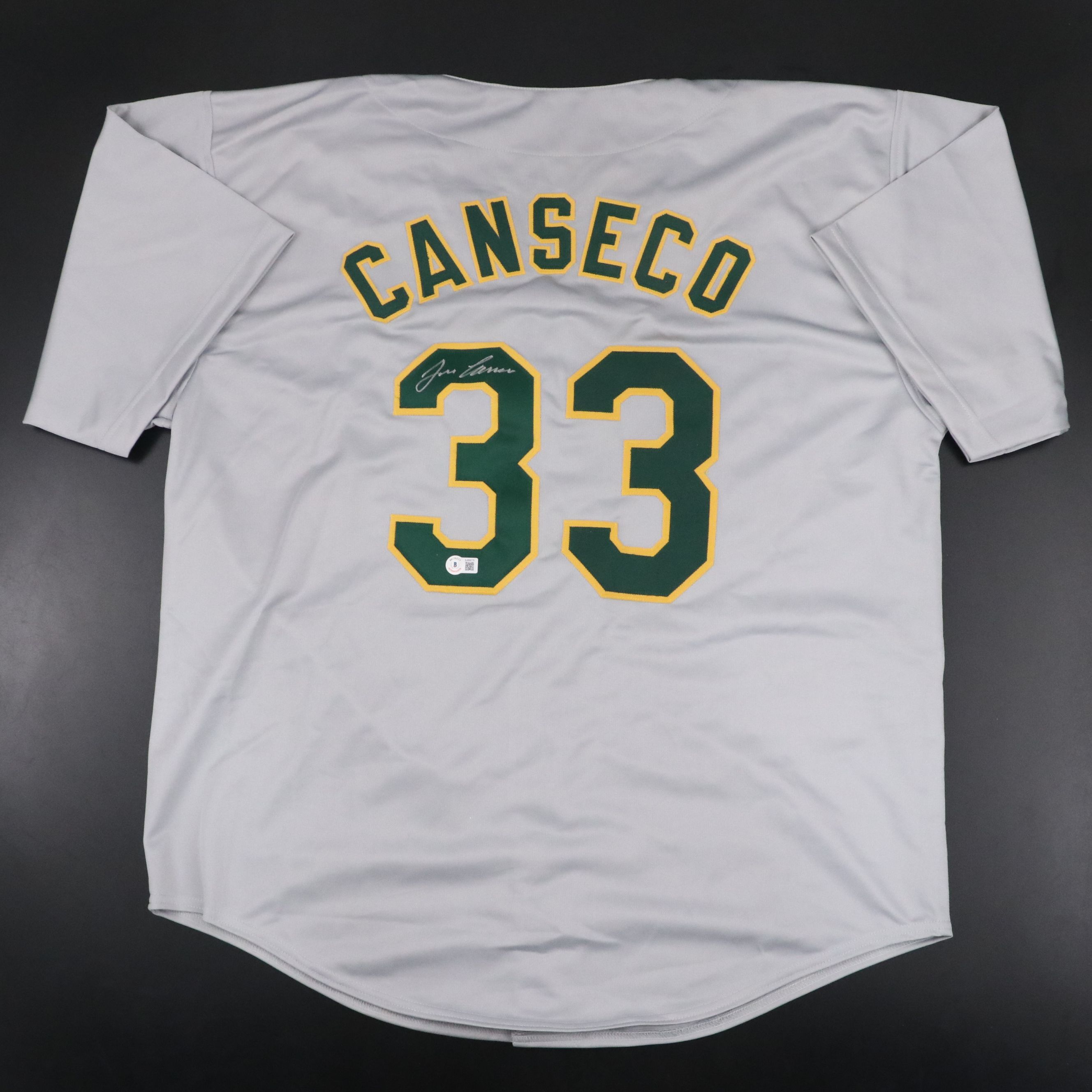 Jose Canseco Signed Oakland Athletics Jersey with Roger Clemens Signed Baseball