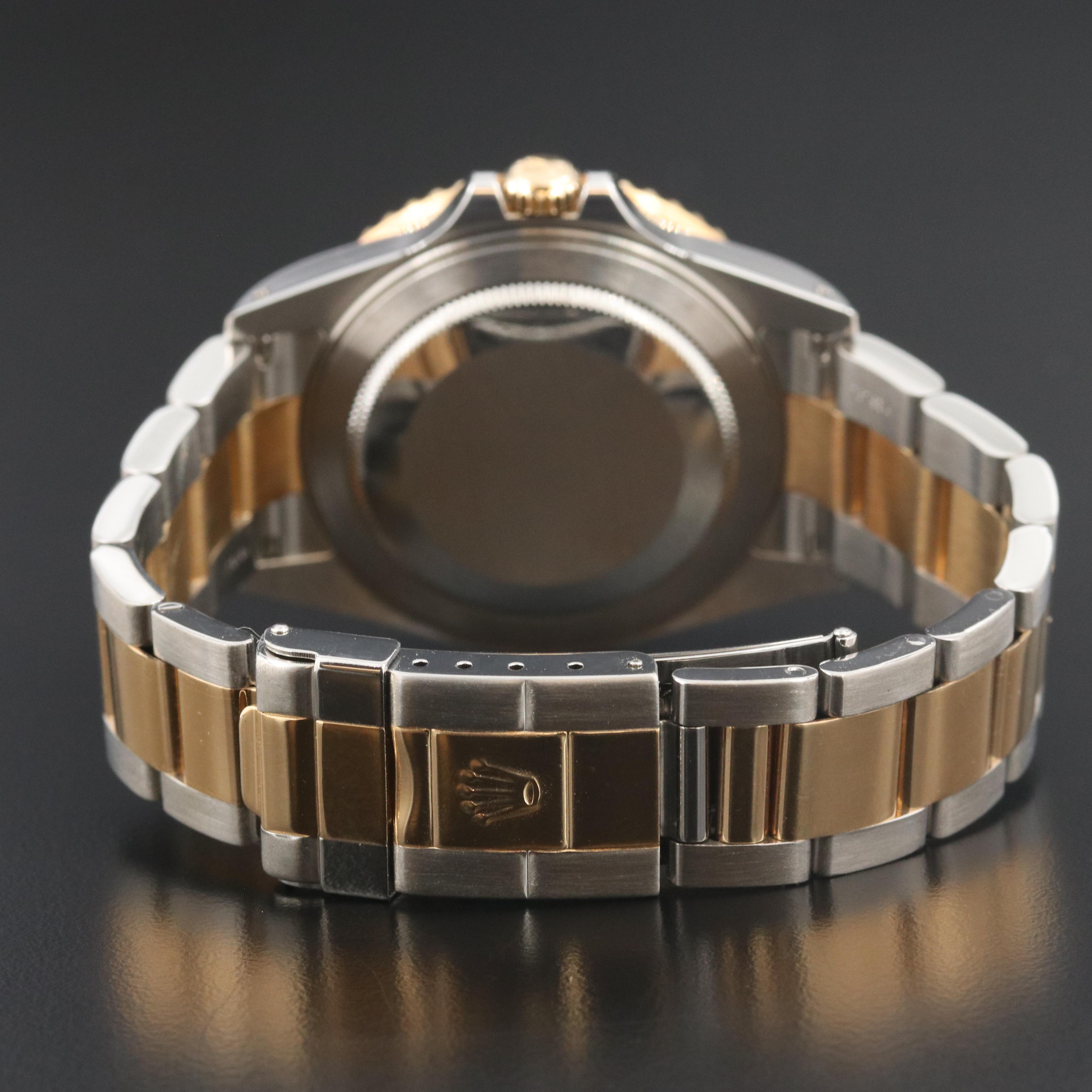 Rolex GMT-Master II 16713 Black 40mm 18k & Steel Automatic Watch circa 2000