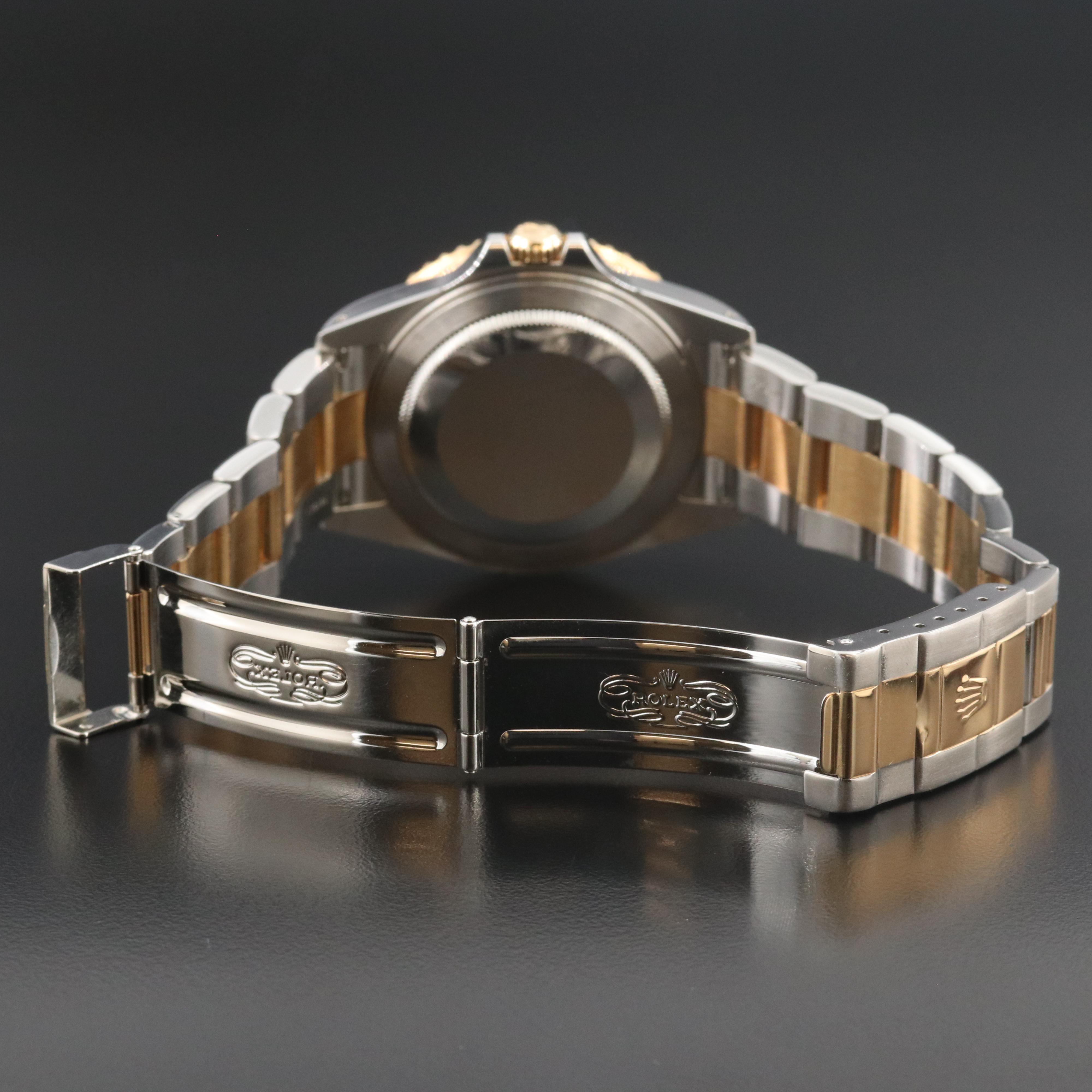 Rolex GMT-Master II 16713 Black 40mm 18k & Steel Automatic Watch circa 2000