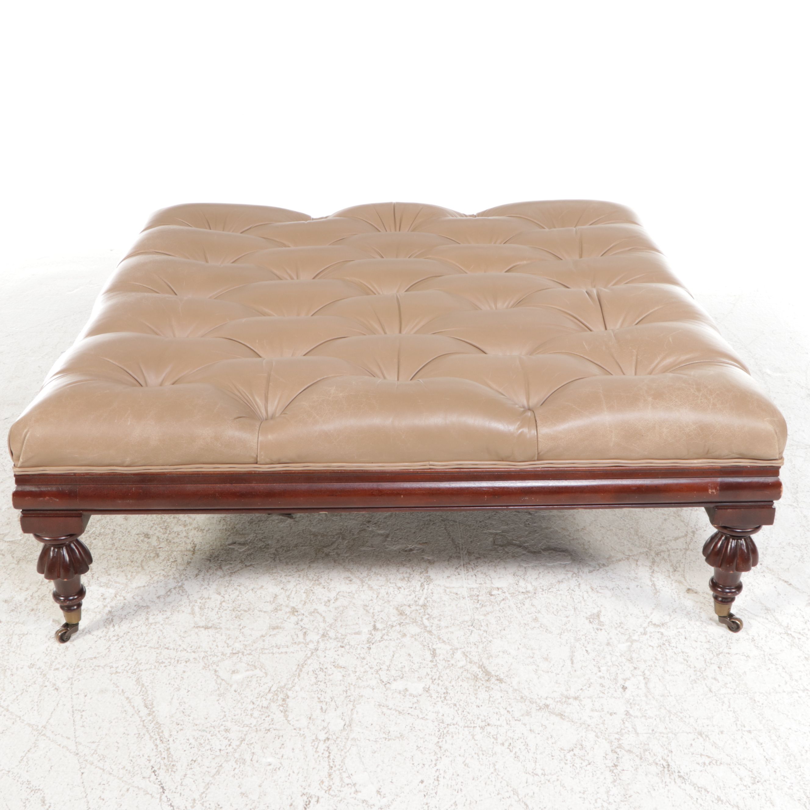 The Henredon Leather Co. Edwardian Style Tufted Leather and Carved Wood Ottoman
