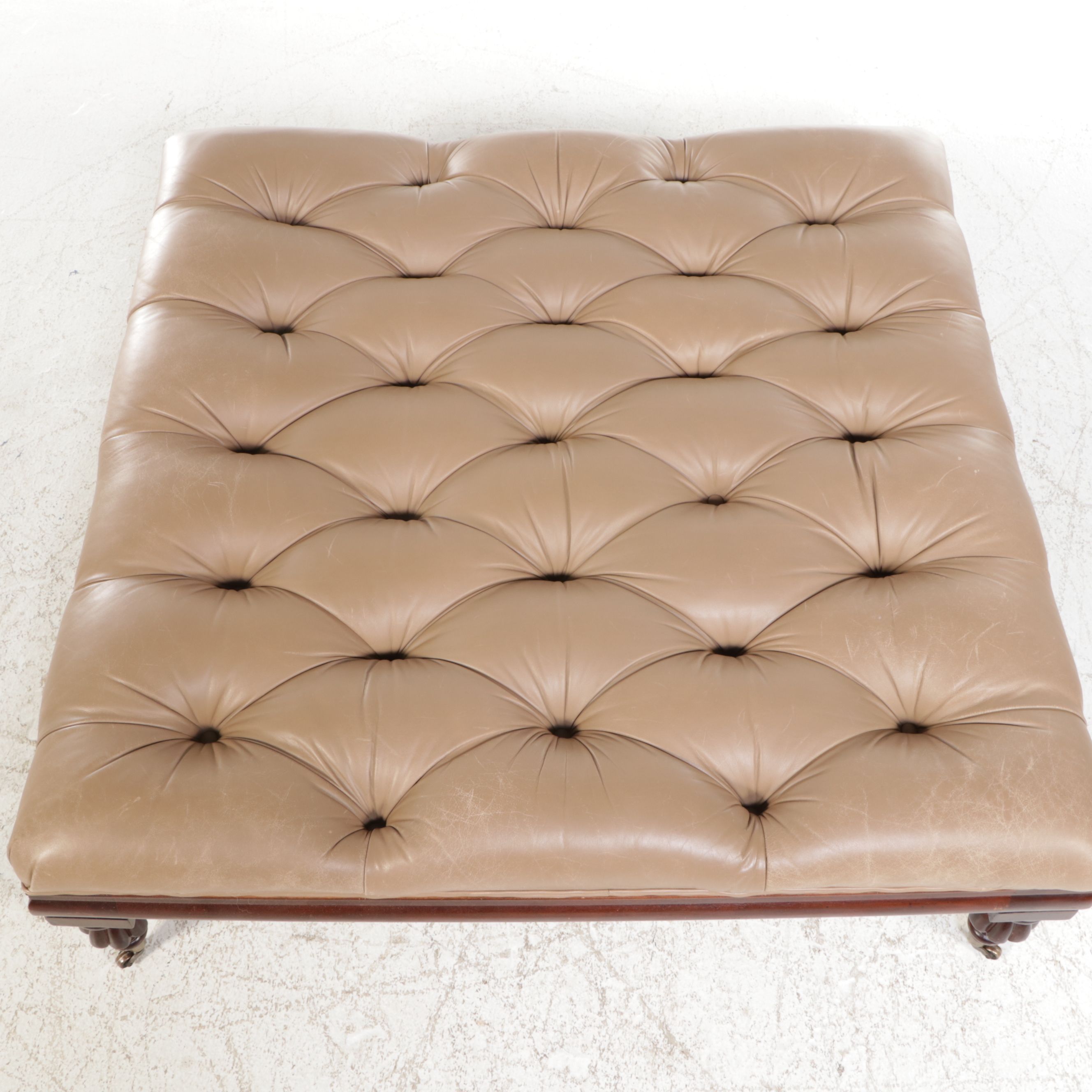 The Henredon Leather Co. Edwardian Style Tufted Leather and Carved Wood Ottoman