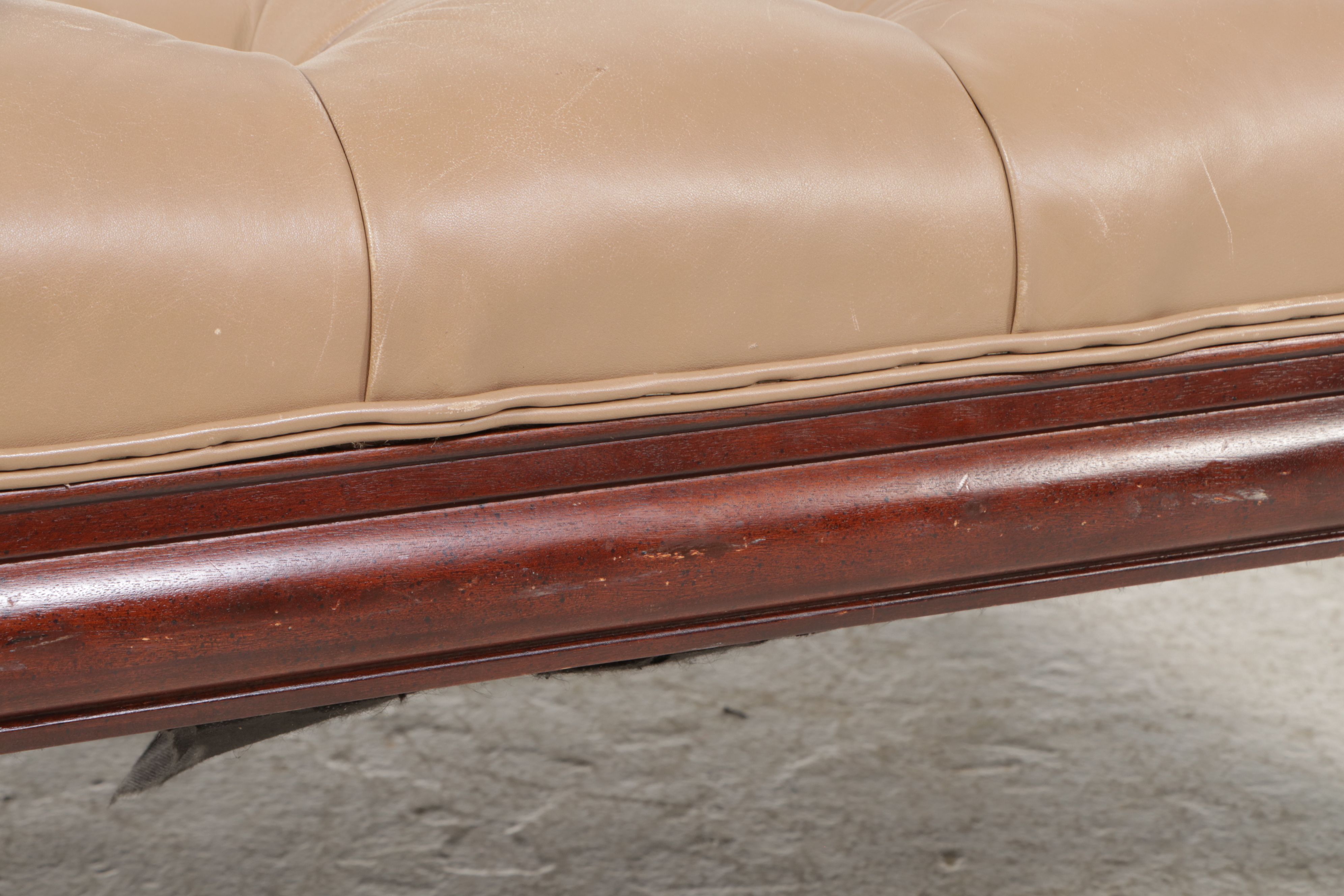 The Henredon Leather Co. Edwardian Style Tufted Leather and Carved Wood Ottoman