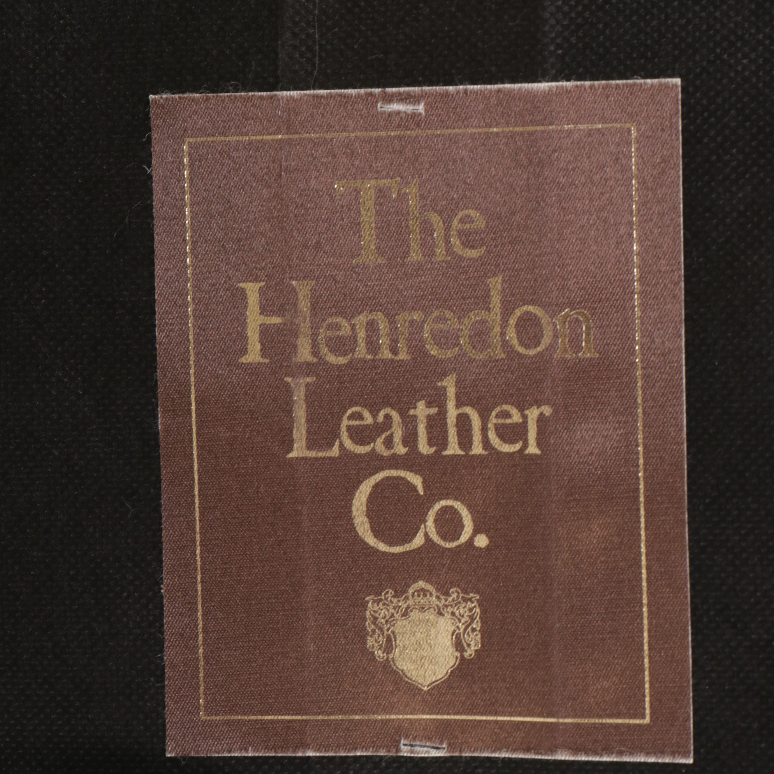 The Henredon Leather Co. Edwardian Style Tufted Leather and Carved Wood Ottoman