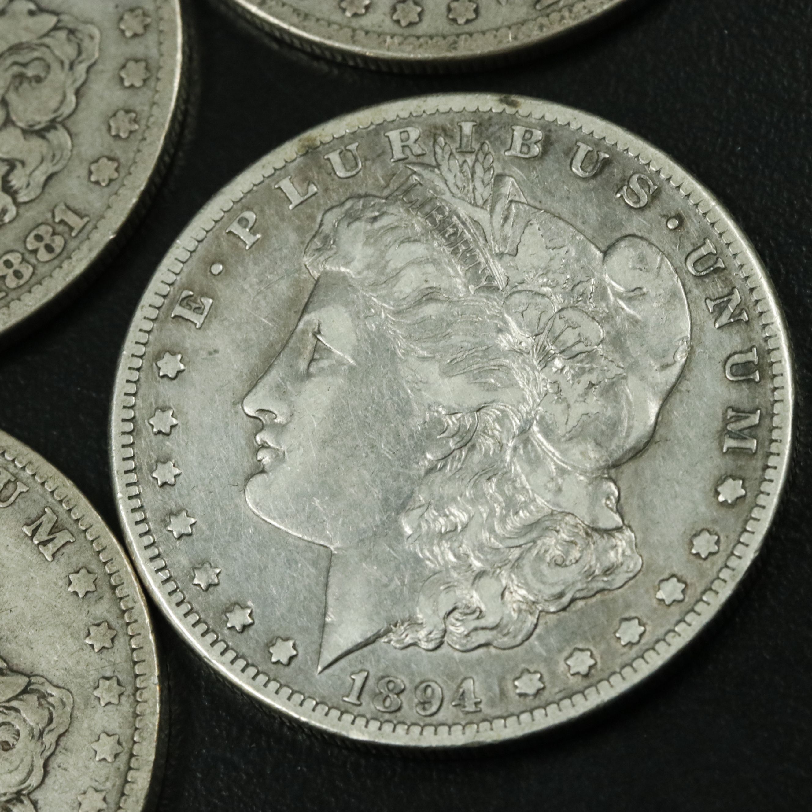 Group of Five Morgan Silver Dollars Including an 1879