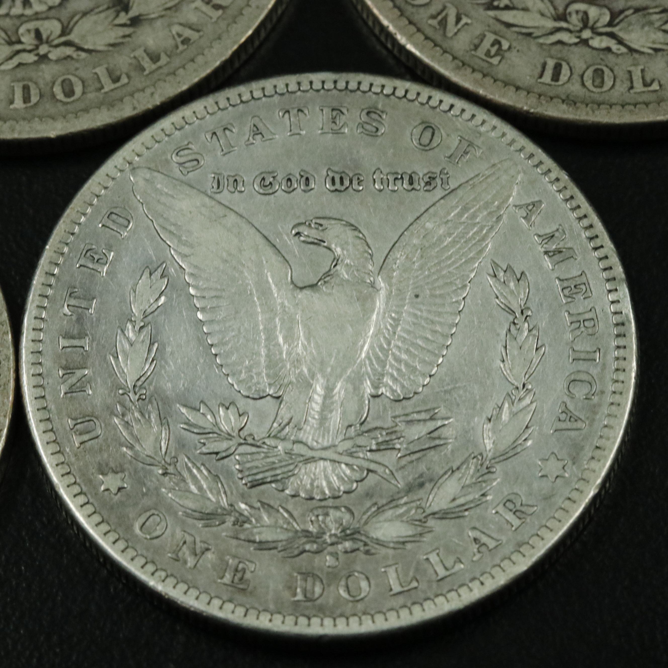Group of Five Morgan Silver Dollars Including an 1879